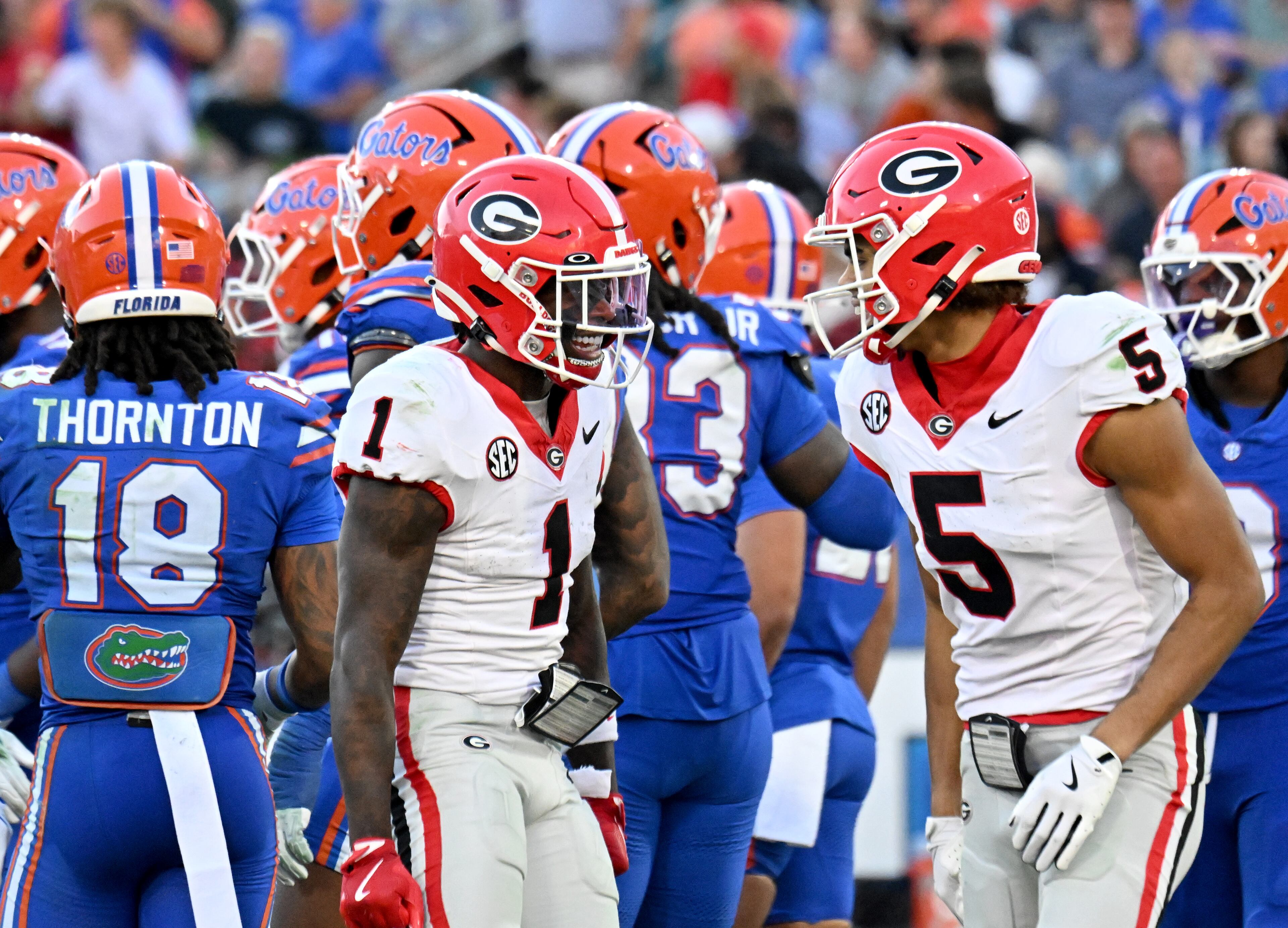 Georgia wide receiver Noah Thomas (5) celebrates with teammates after scoring a touchdown during the second half in an NCAA football game, Saturday, November 1, 2025, Jacksonville, Fla. Georgia won 24-20 over Florida. (Hyosub Shin / AJC)