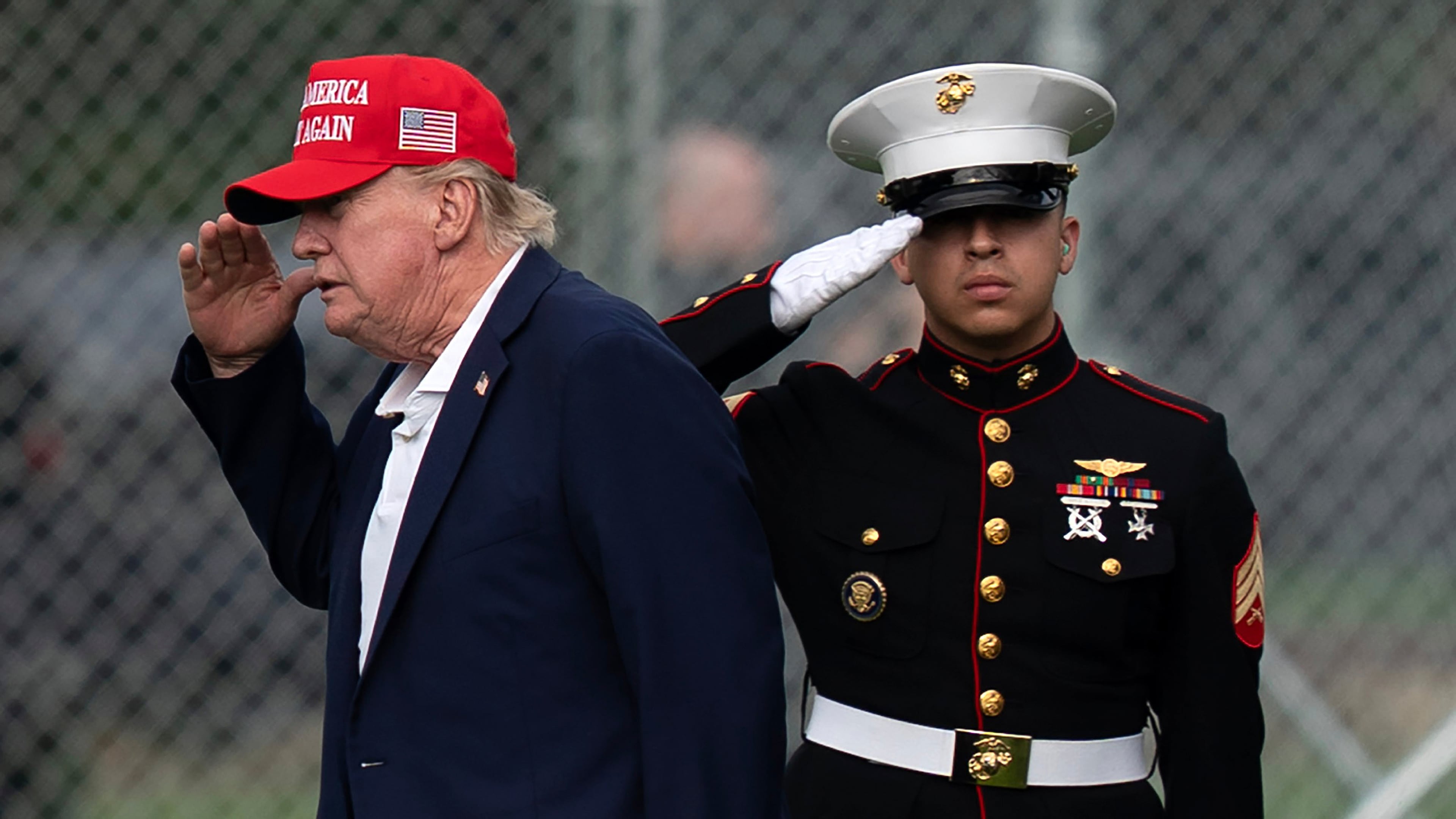 President Donald Trump returns a salute as he walks from Marine One to his limousine upon his arrival at the Ellipse just outside of the White House, Sunday, Aug. 16, 2026, in Washington. (AP Photo/Jose Luis Magana)
