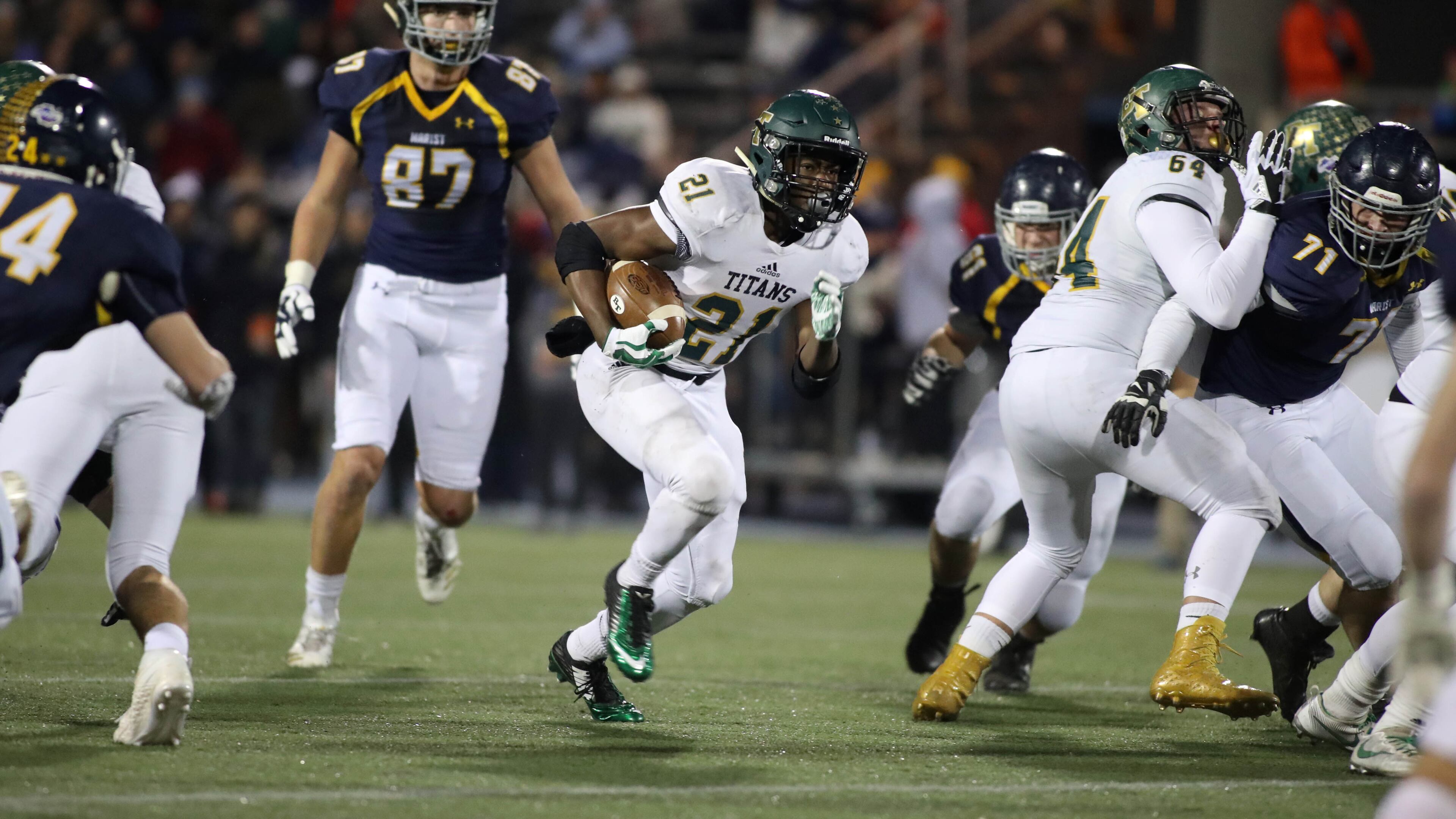 Blessed Trinity running back Elijah Green (21) runs for yardage in the first half against Marist during the Class AAAA Championship game at Marist School Friday, December 15, 2017, in Atlanta.