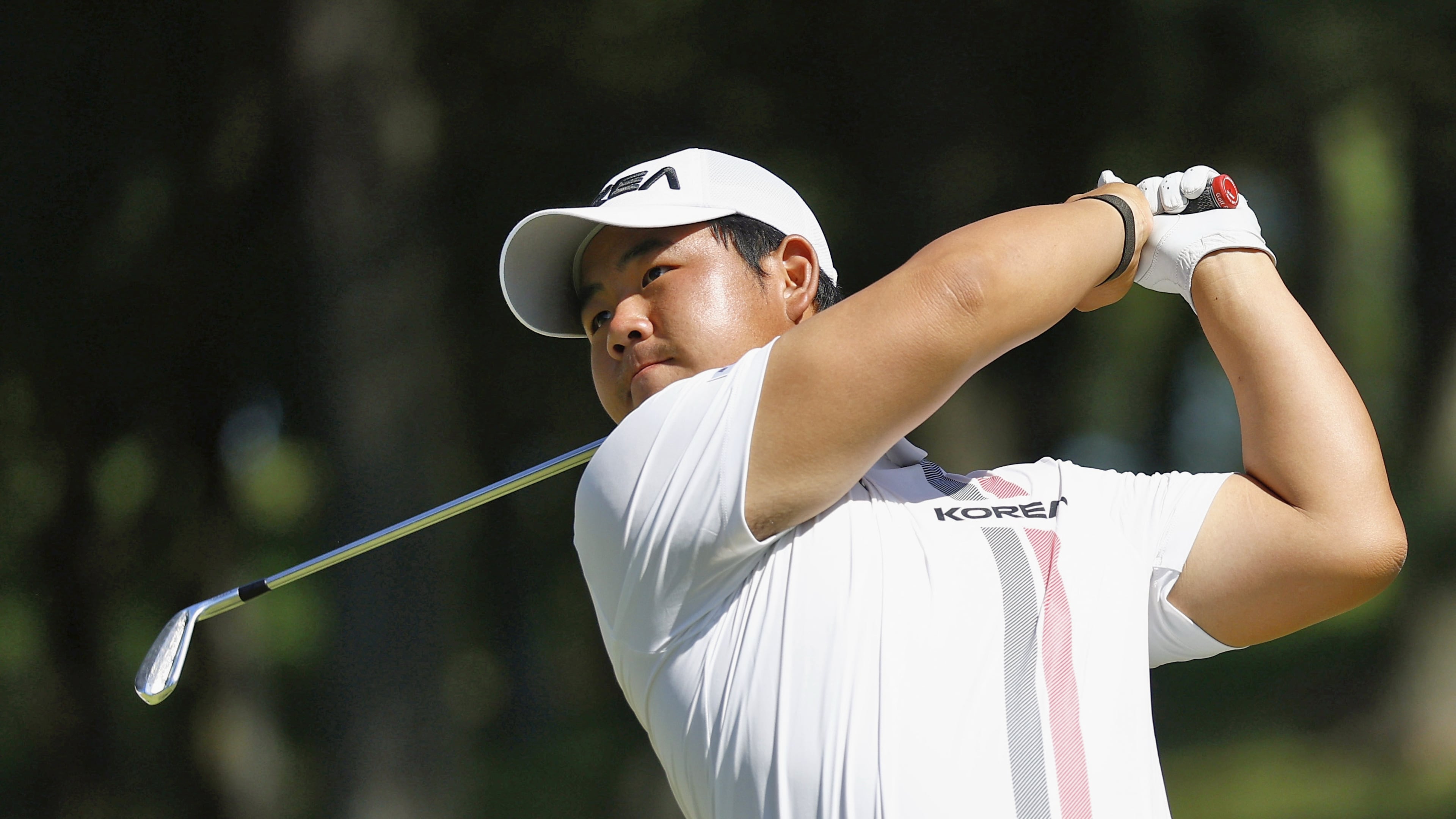 South Korea's Tom Kim, also known as Kim Joo-hyung, plays a shot in the men’s singles in golf at the Asian Games in Kasugai, central Japan, Saturday, Oct. 3, 2026. (Natsumi Yasumoto/Kyodo News via AP)