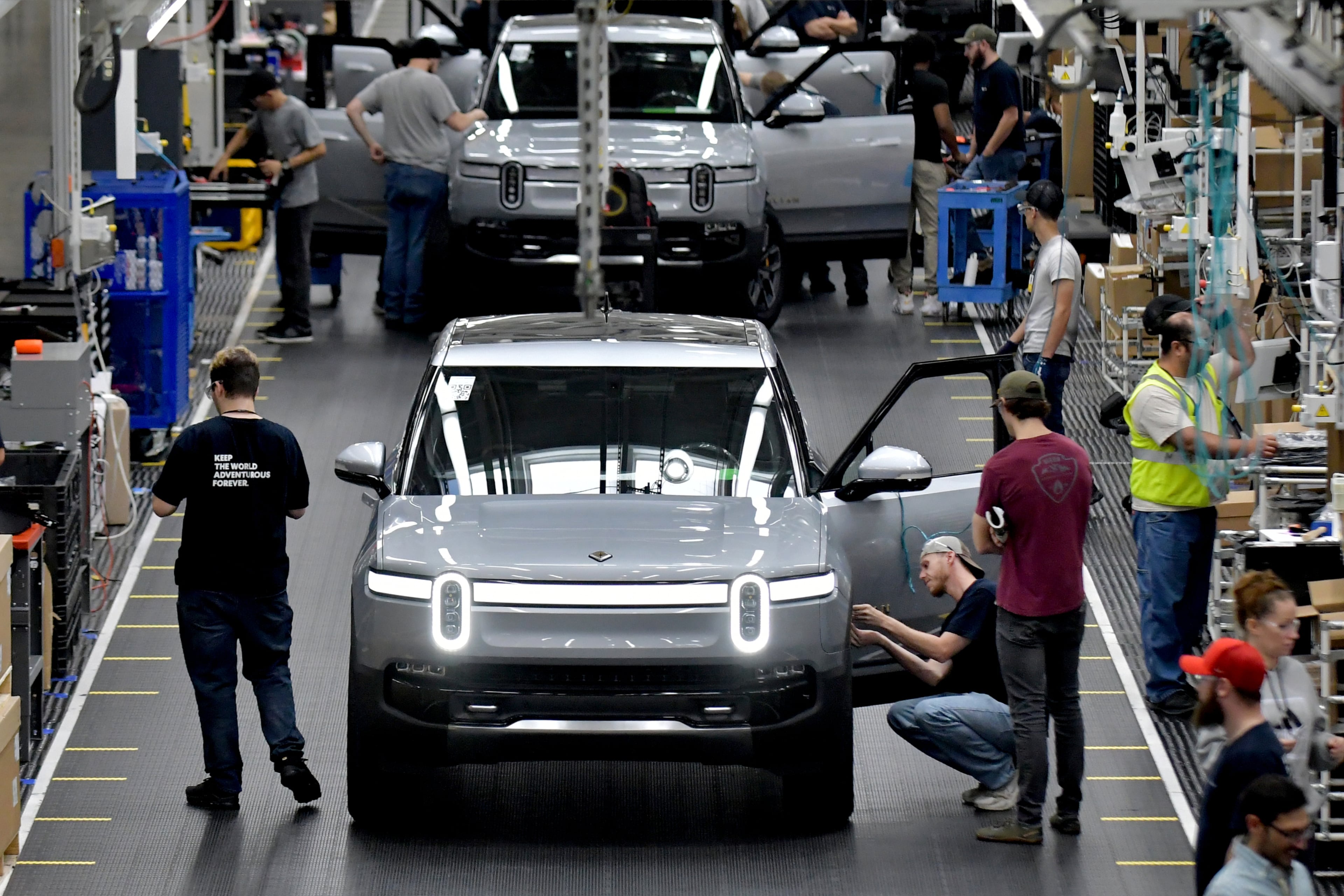 Manufacturing workers assemble electric vehicles at Rivian in Normal, Ill., on July 20, 2022. (Photo for the Atlanta Journal Constitution by Ron Johnson)