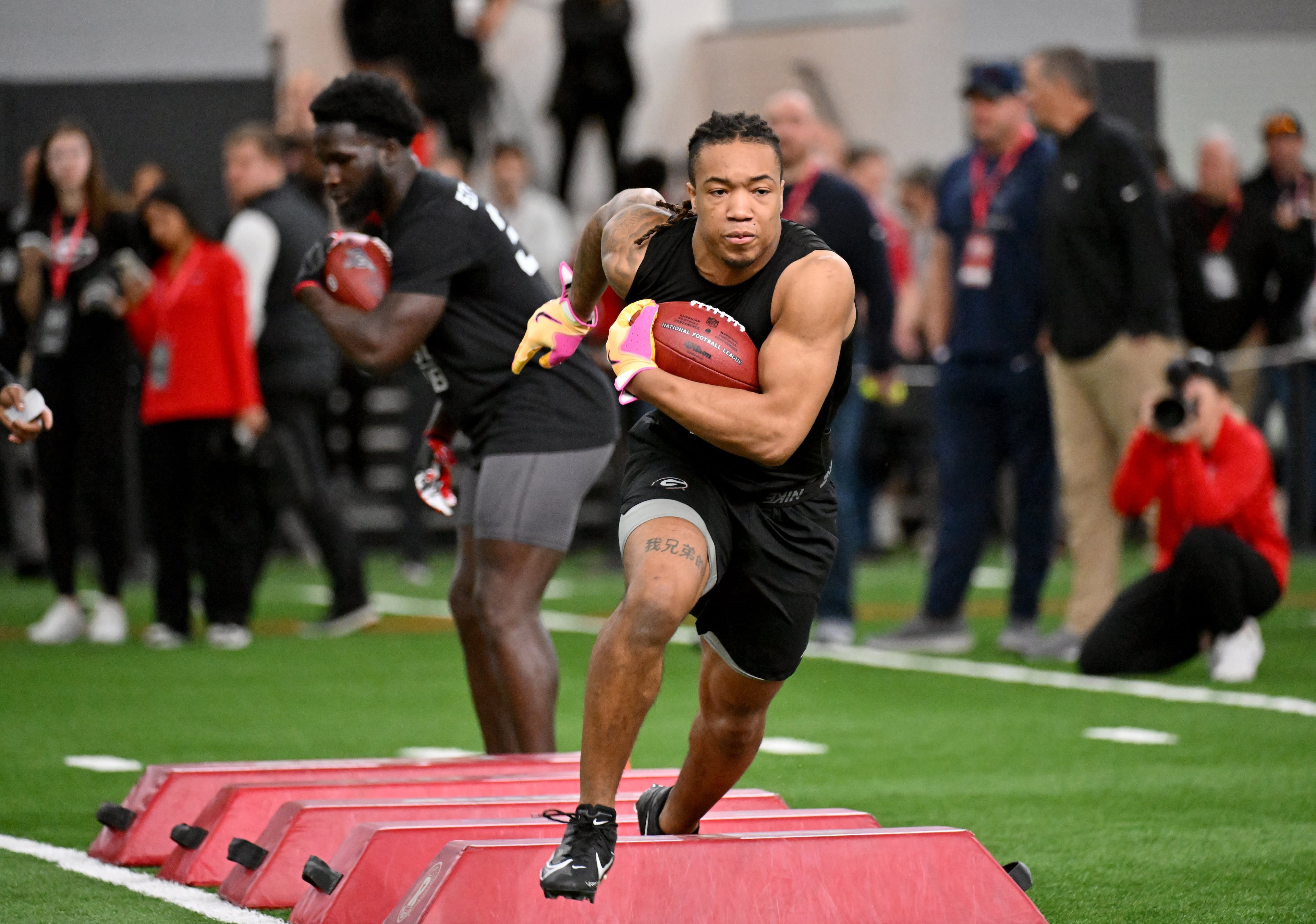 Georgia running back Kendall Milton makes a cut in front of coaches and scouts during Georgia Pro Day at Payne Indoor Athletic Facility, Wednesday, Mar. 13, 2024, in Athens. (Hyosub Shin / Hyosub.Shin@ajc.com)