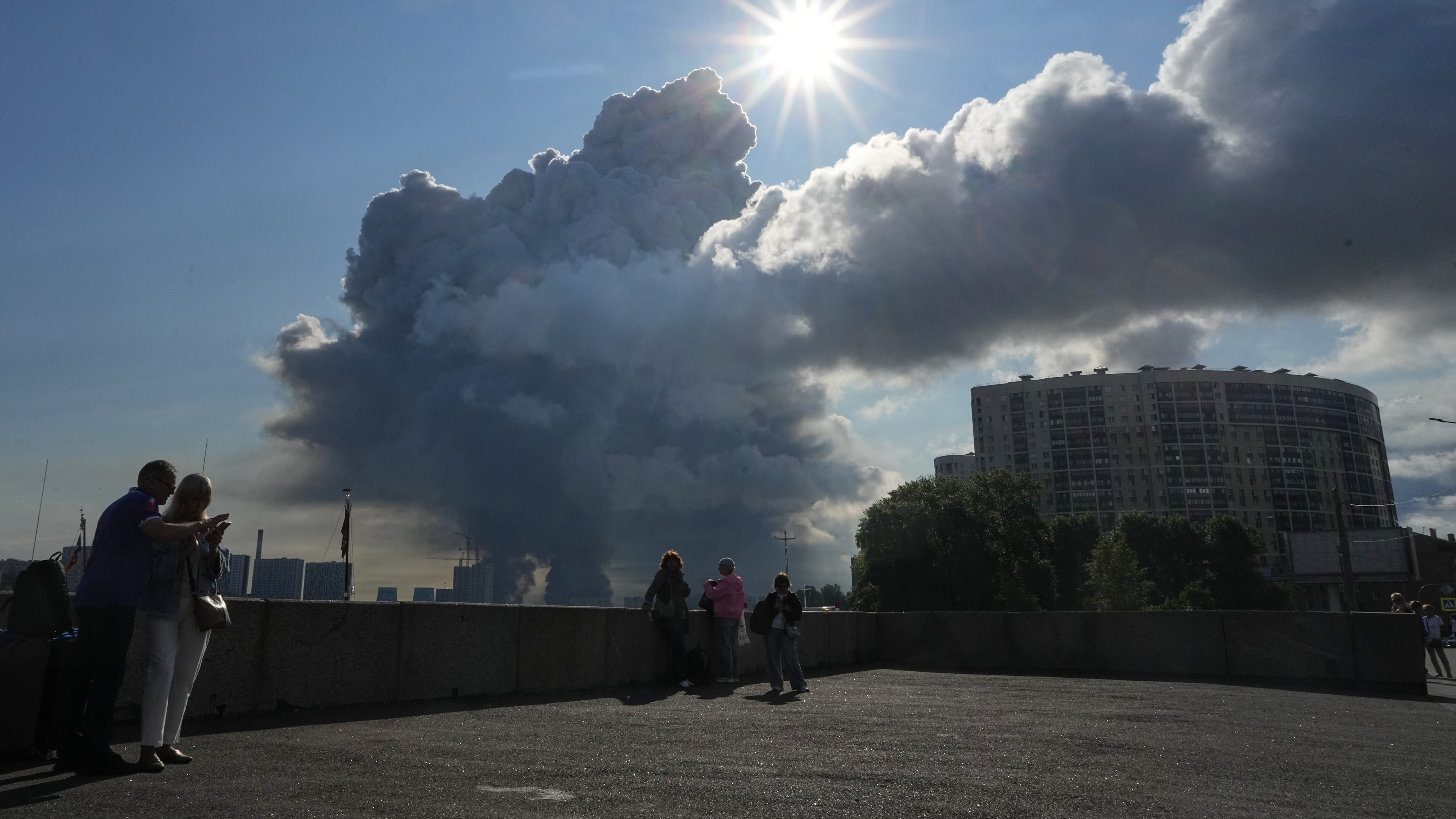 FILE - Smoke rises following a Ukrainian drone strike on a warehouse belonging to online retailer Wildberries, in St. Petersburg, Russia, on Friday, July 24, 2026. (UGC via AP, File)