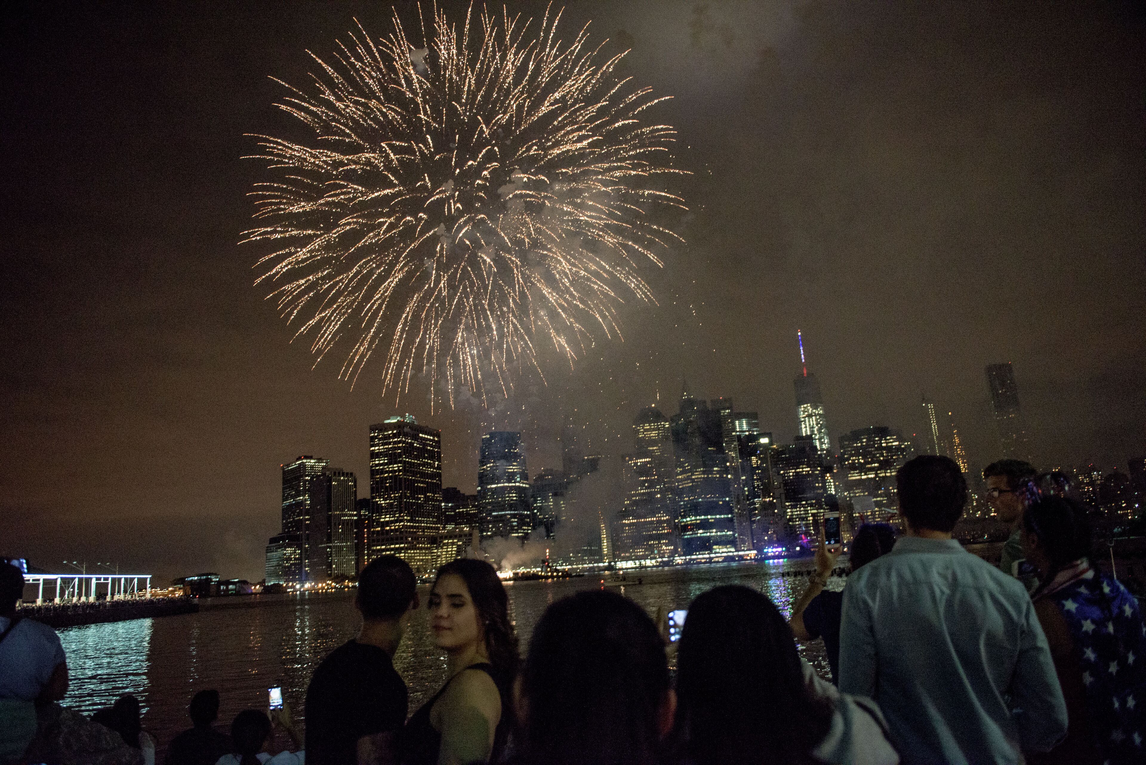 NEW YORK, NY - JULY 4: People watch Macy's Fourth of July Fireworks from Brooklyn Bridge Park on July 4, 2015 in the Brooklyn borough of New York City. The celebrations mark the nation's 239th Independence Day. (Photo by Andrew Renneisen/Getty Images)
