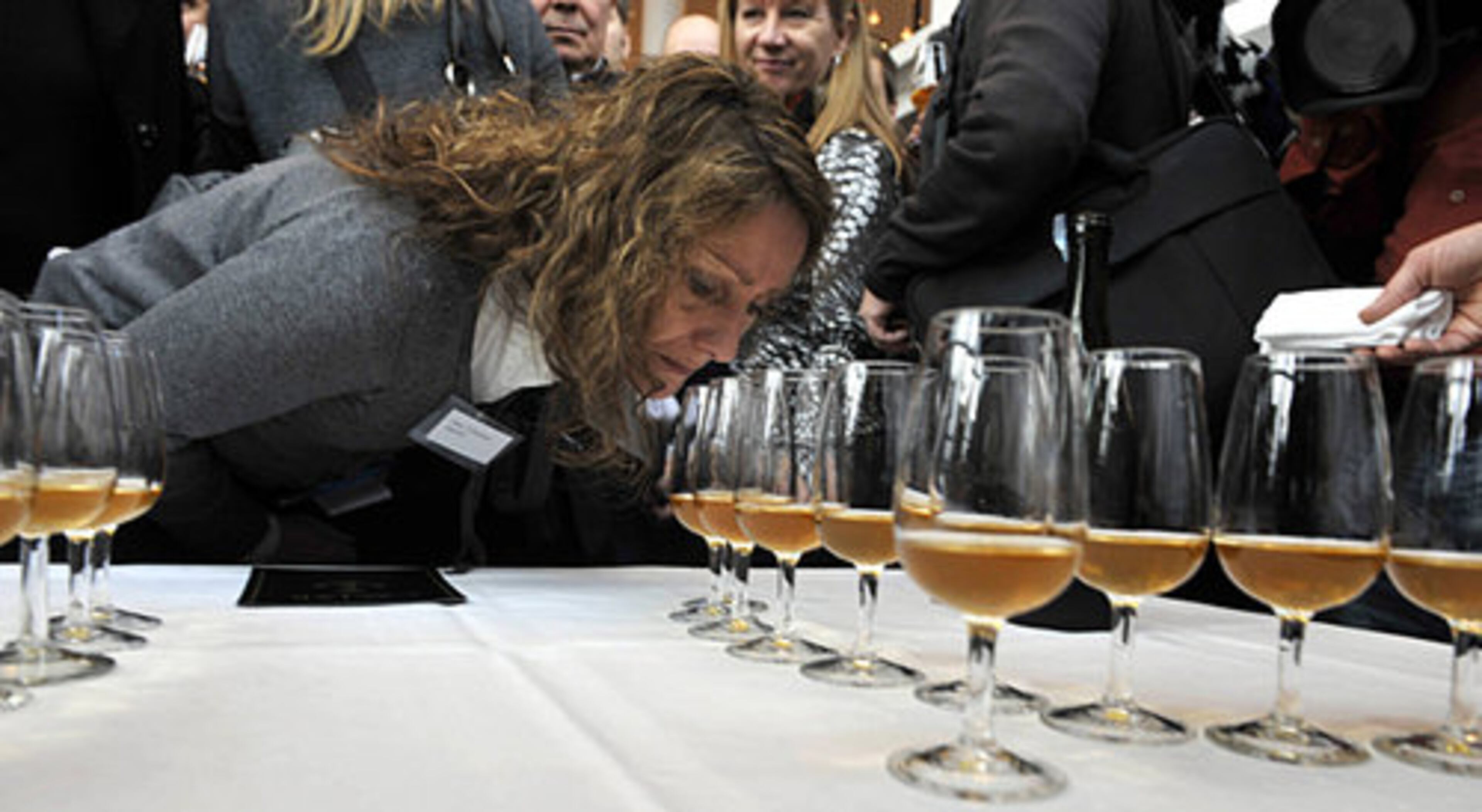 An unidentified woman smells the aroma of one of the bottles, at a tasting in Mariehamn, Finland.