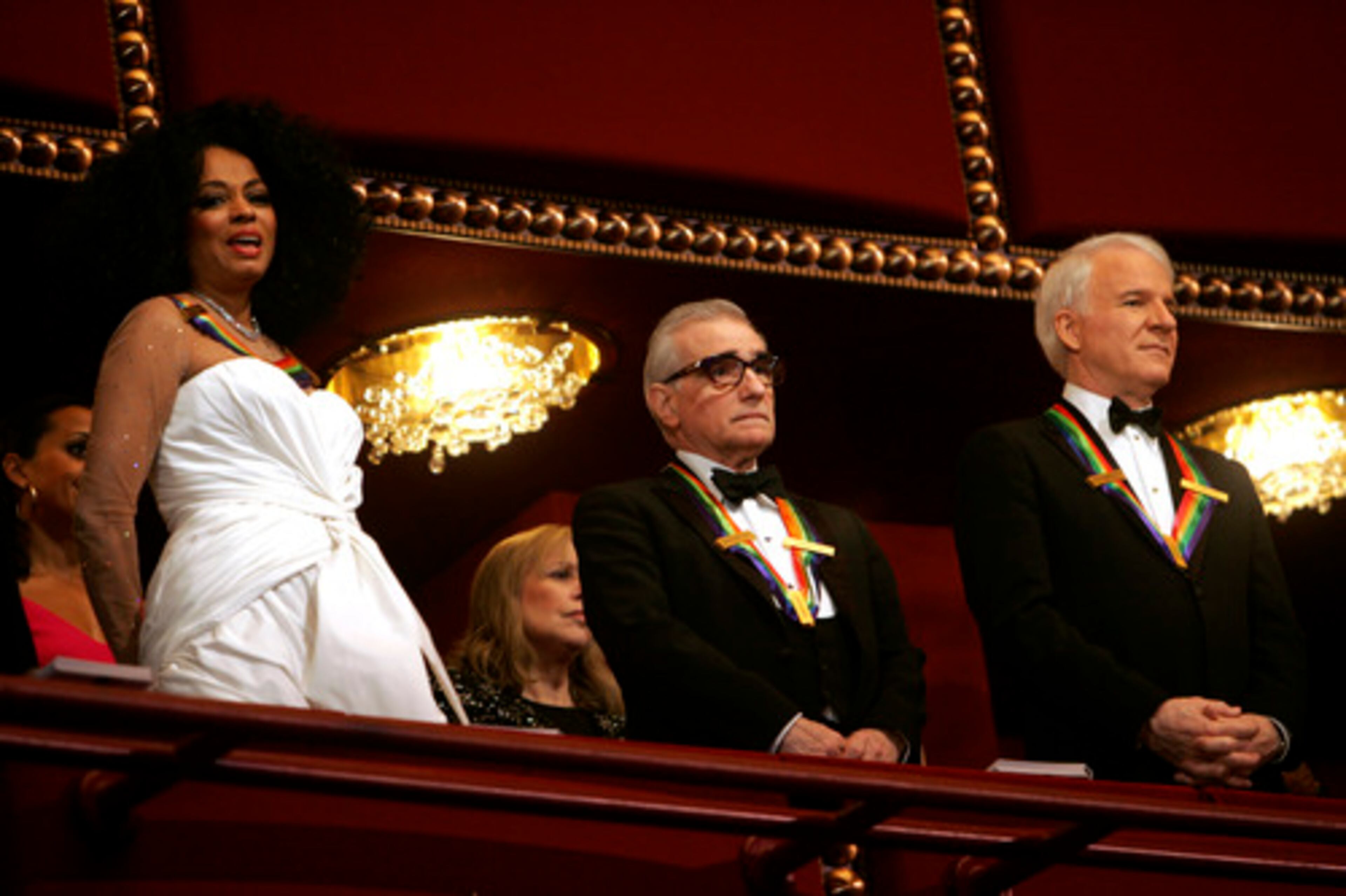 Honorees Diana Ross, Martin Scorcese and Steve Martin stand in the President's box at the John F. Kennedy Center for the Performing Arts.