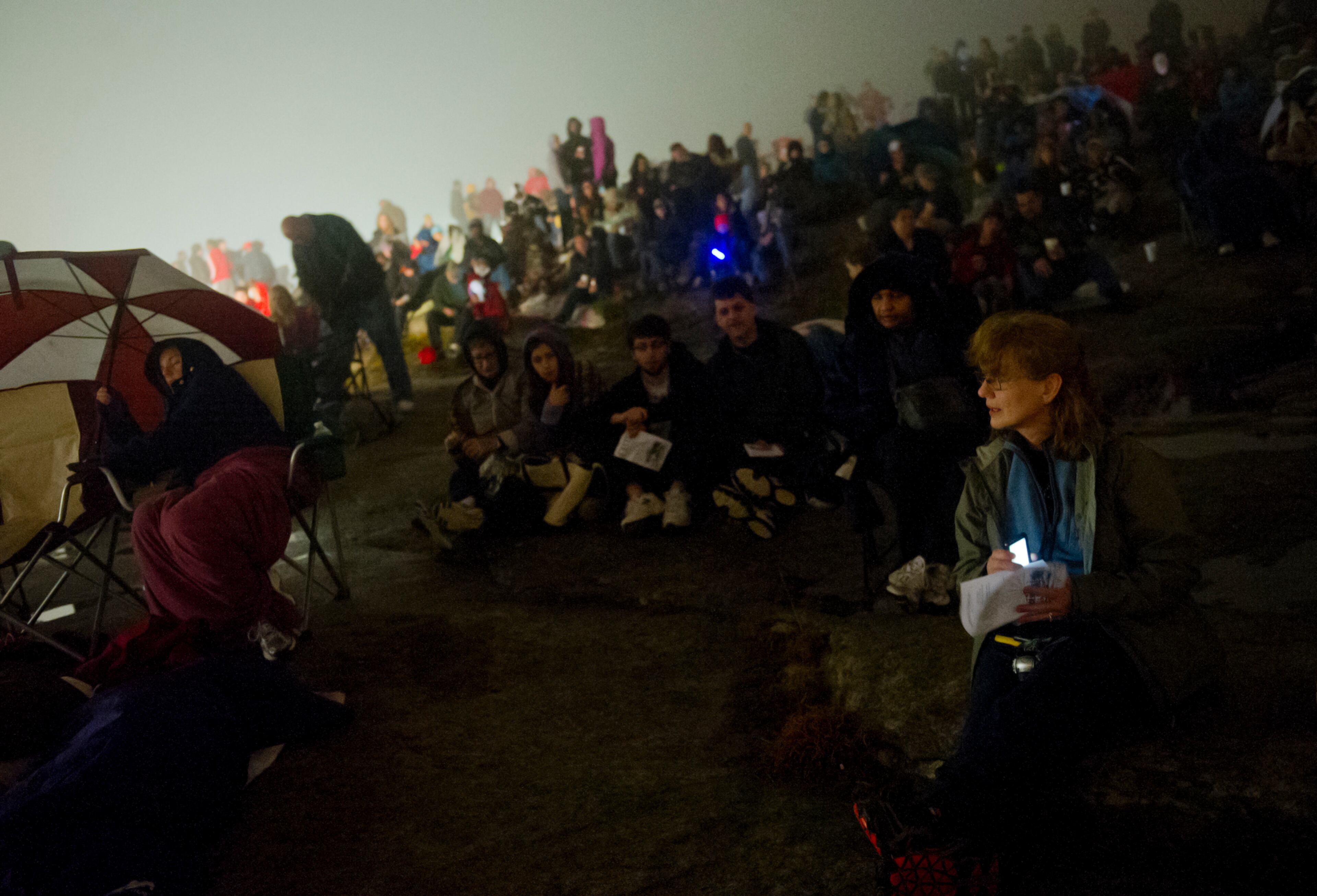 Anna Wing (right) waits for the service to begin.