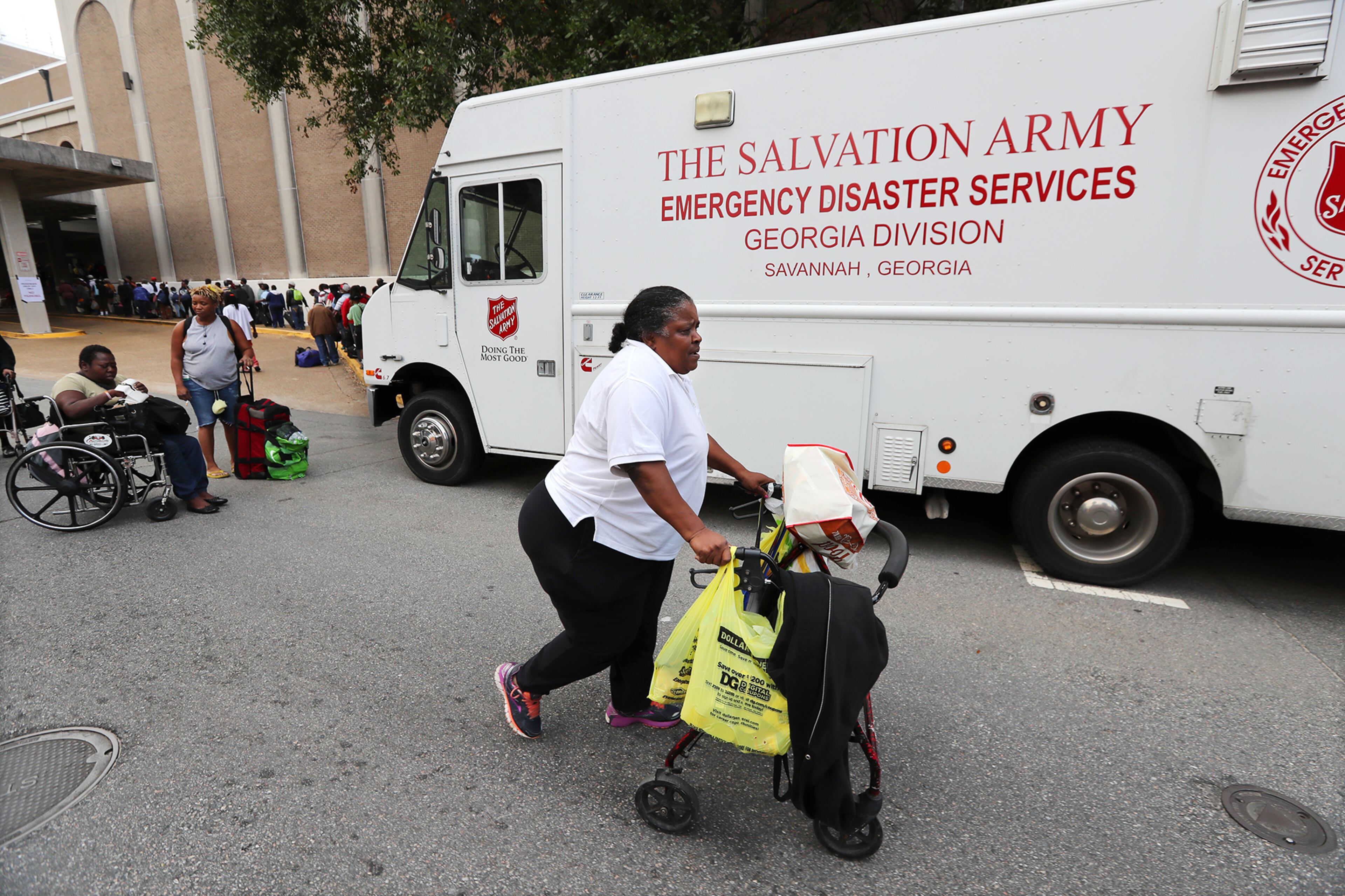 September 9, 2017 Savannah: Gloria Daniels, 70, arrives using her walker from her home to join hundreds of local residents being evacuated from the city at the Savannah Civic Center during a mandatory evacuation on Saturday, September 9, 2017, in Savannah. Officials are expecting 1,500 to 3,000 without transportation to board buses being provided at the location. Curtis Compton/ccompton@ajc.com