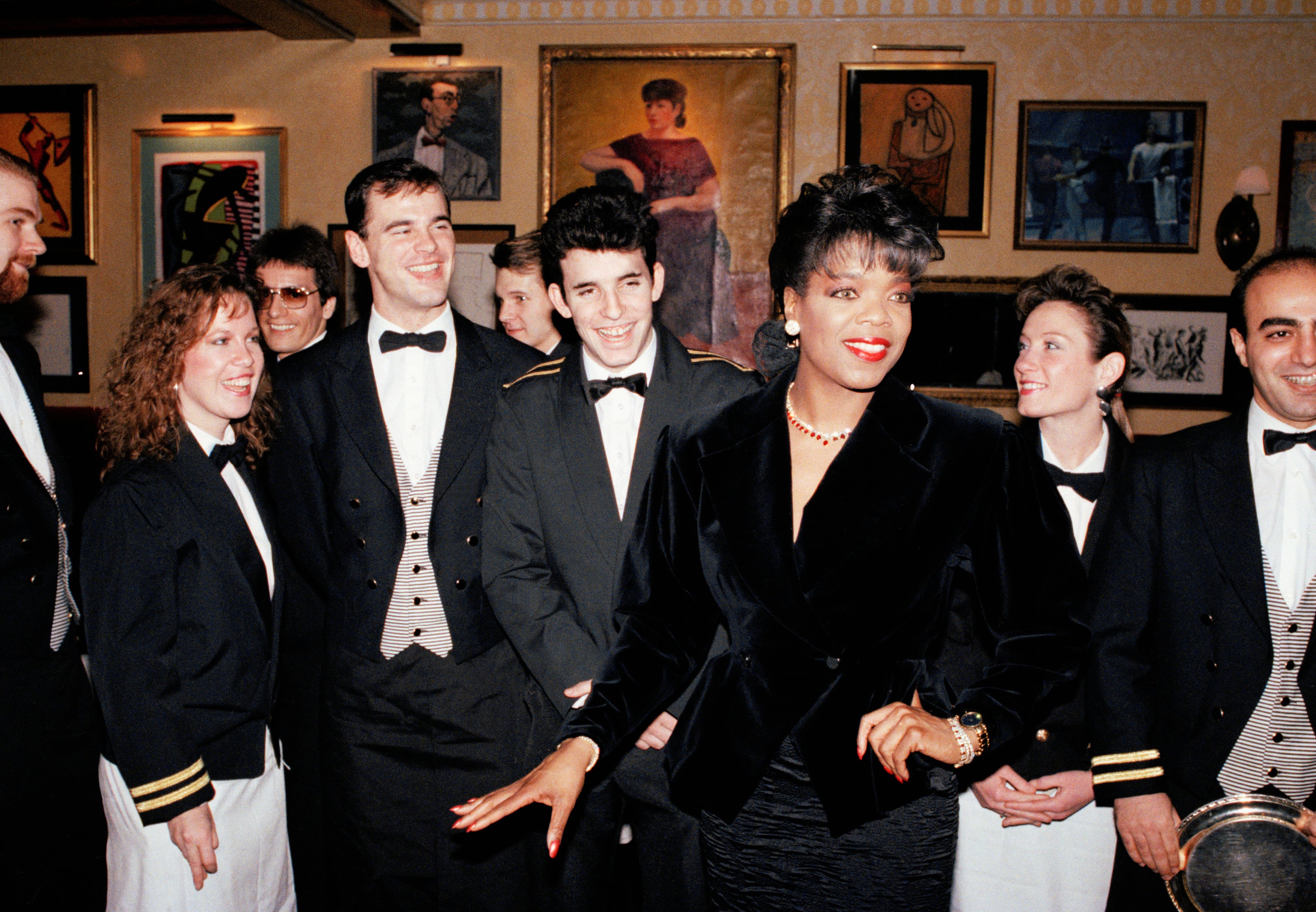 Oprah Winfrey and employees celebrate the opening of her new restaurant "the Eccentric" on Tuesday Feb. 21, 1989 in Chicago. (AP Photo/Jonathan Kirn)