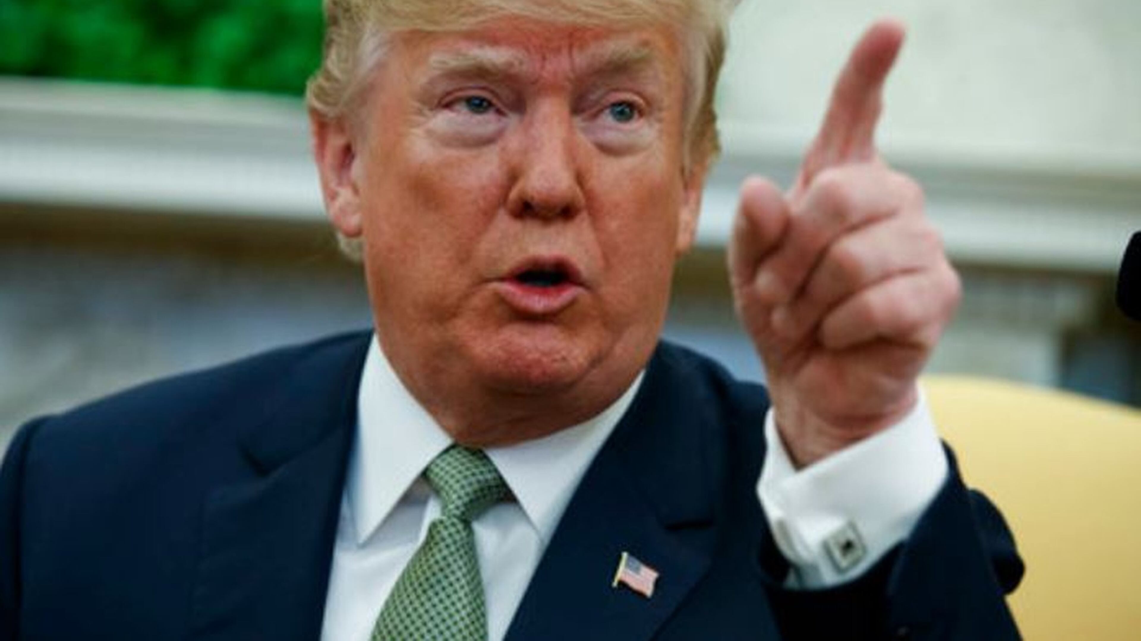President Donald Trump talks with reporters in the Oval Office March 15, 2018. (AP Photo/Evan Vucci)