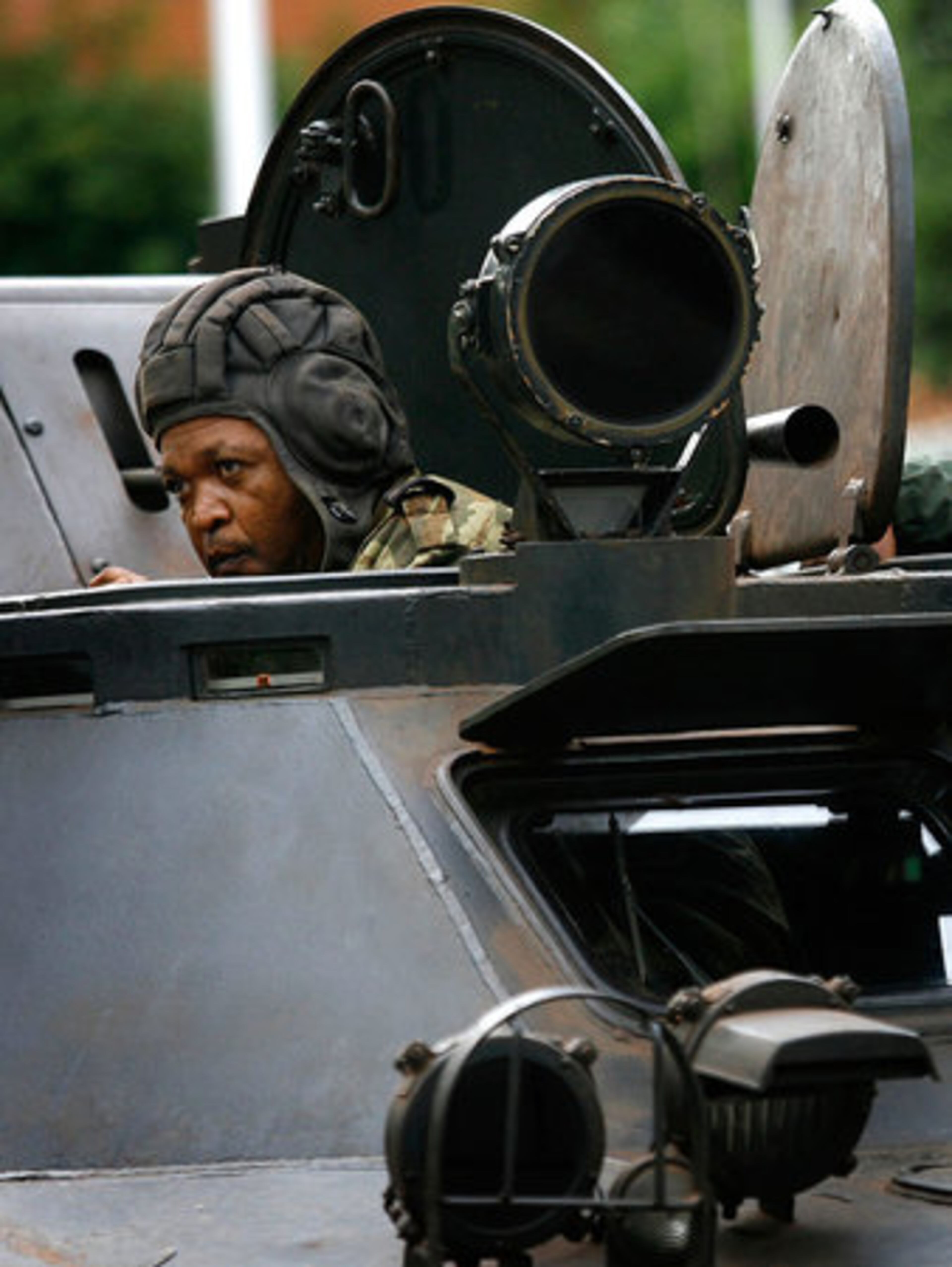 Rebel soldiers loyal to opposition leader Rajoelina take position around the downtown presidential office.