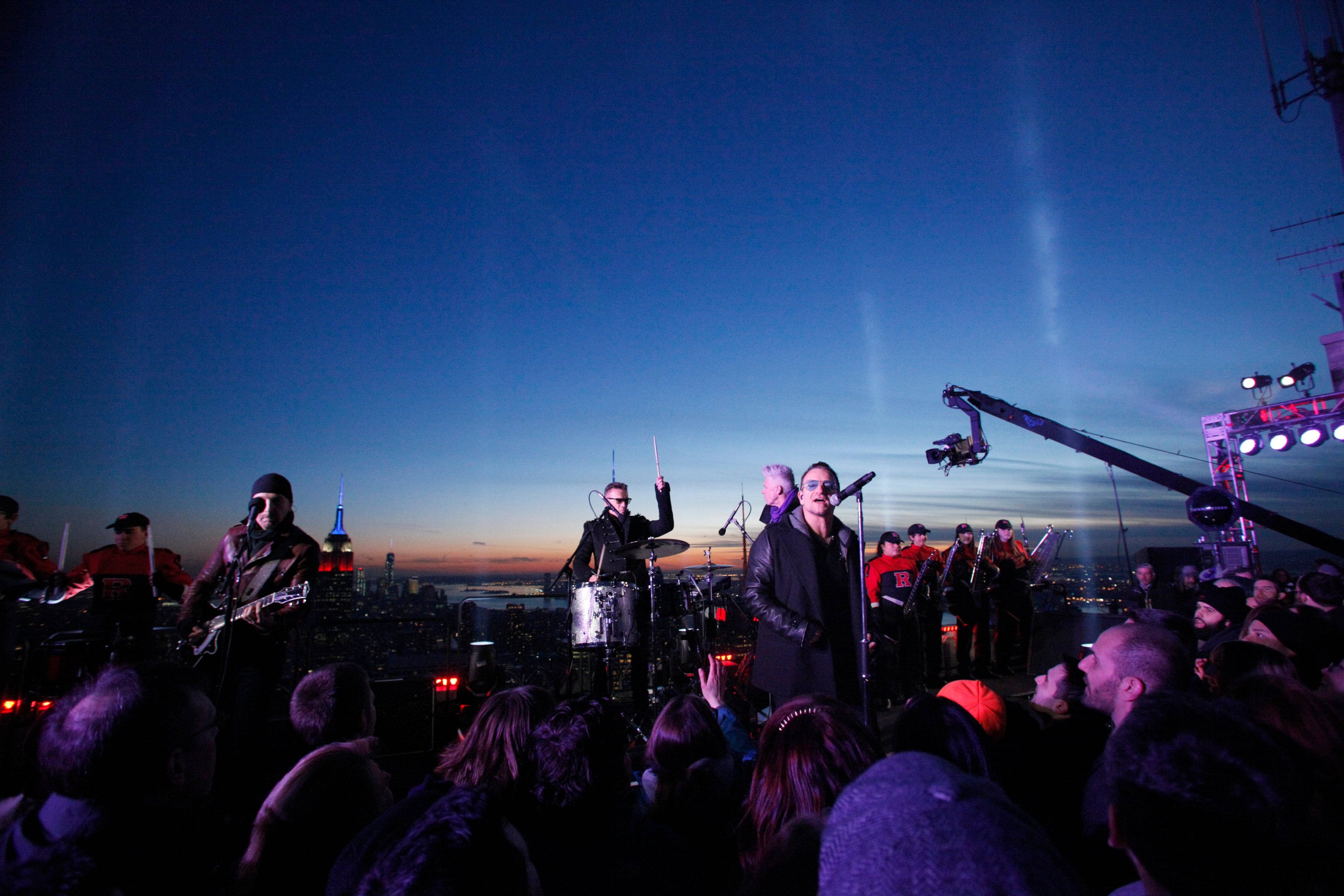 In this photo provided by NBC, U2 performs "Invisible," atop the G.E Building during "The Tonight Show" on Monday, Feb. 17, 2014, in New York. Jimmy Fallon made his debut Monday as the host of "The Tonight Show," replacing Jay Leno after 22 years.