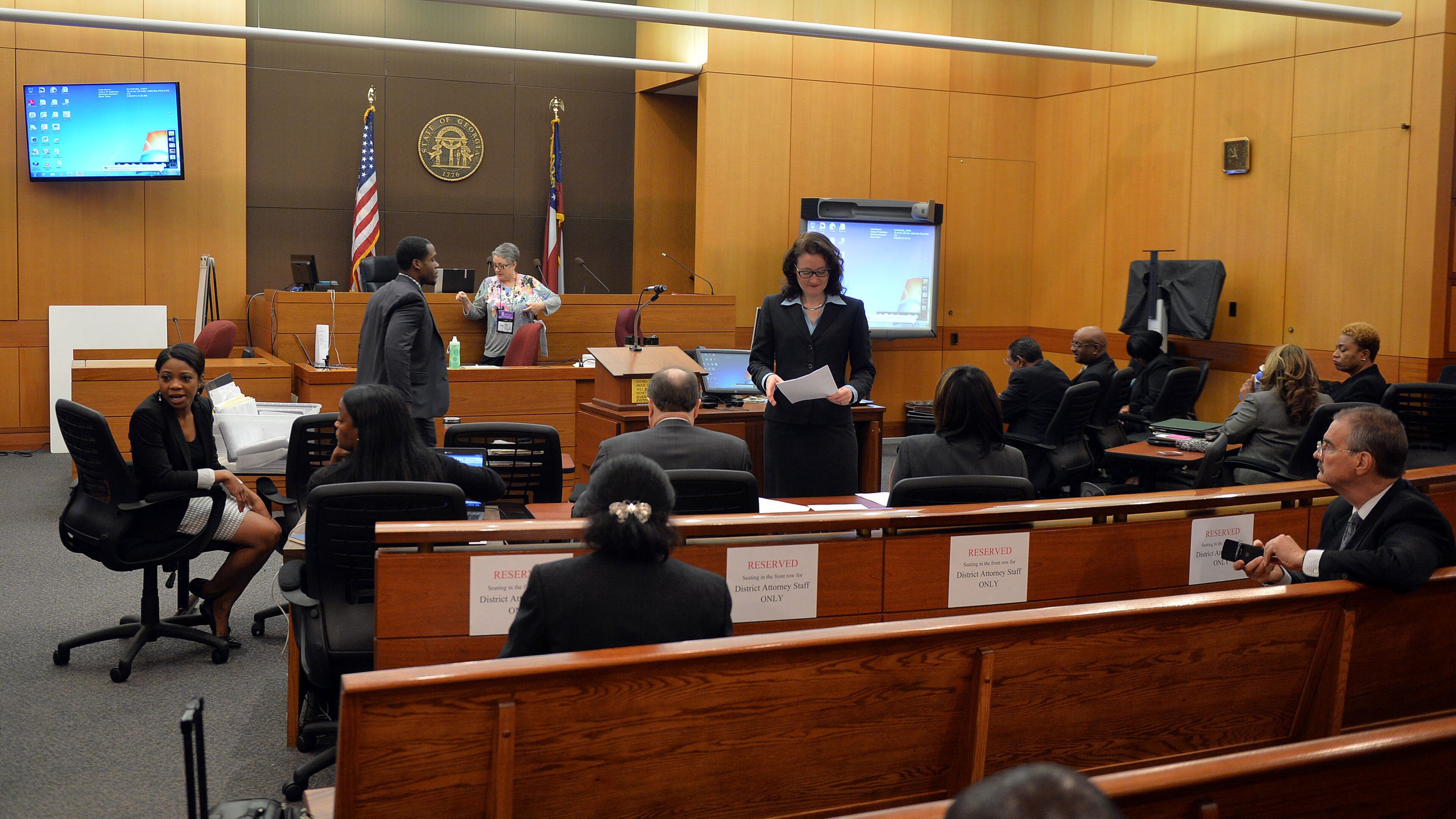 SEPTEMBER 29, 2014 ATLANTA Prosecution and defense attorneys prepare for opening statements. The prosecution will lay out its case during an expected three-hour-long opening statement to kick off the Atlanta Public Schools test-cheating trial before Judge Jerry Baxter in Fulton County Superior Court, Monday September 29, 2014. Not all 12 defense lawyers will be making opening statements; some are planning to reserve theirs until after the prosecution presents its case. KENT D. JOHNSON / KDJOHNSON@AJC.COM