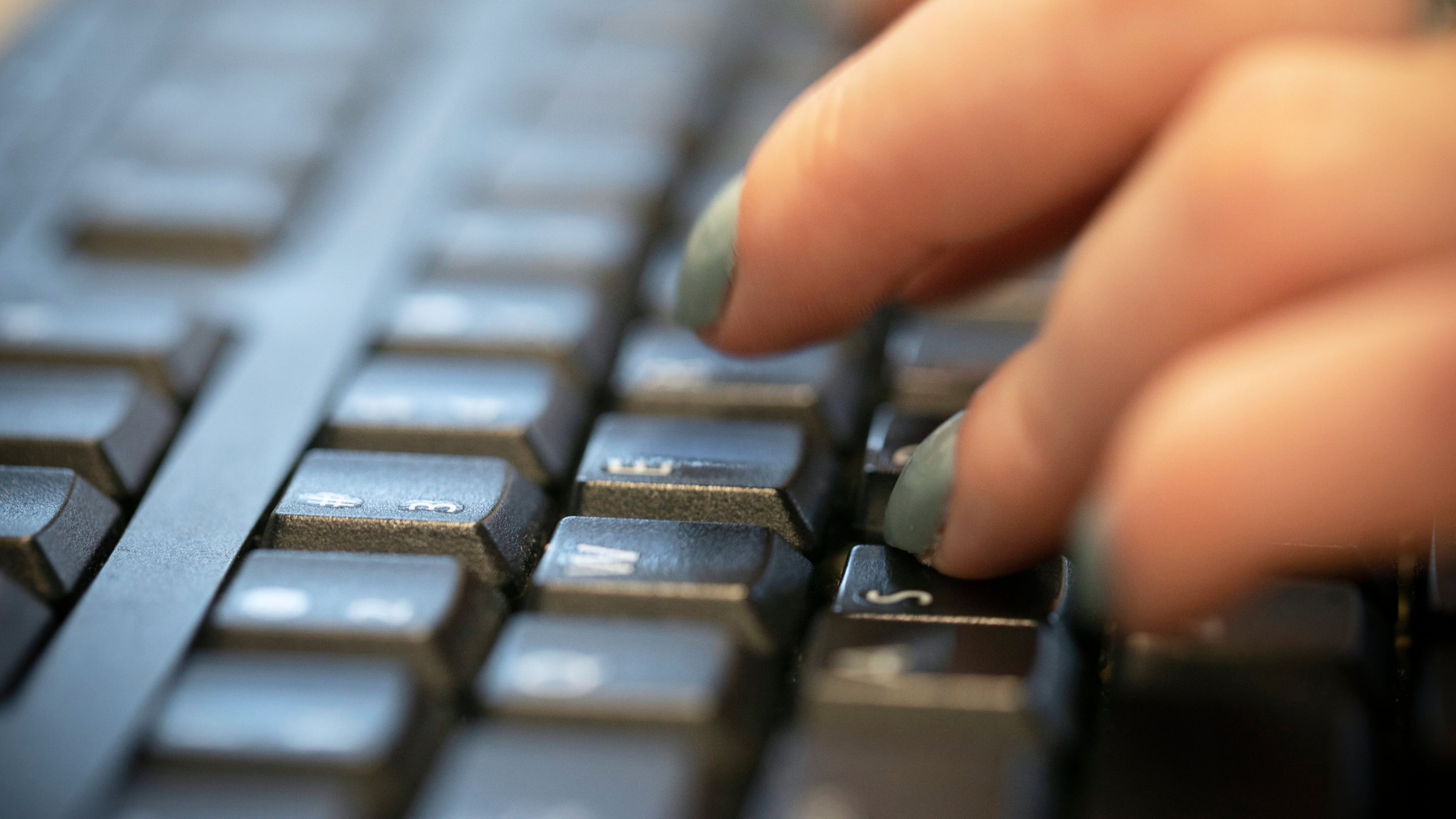 FILE - A person types on a computer keyboard in New York, Oct. 8, 2019. (AP Photo/Jenny Kane, File)