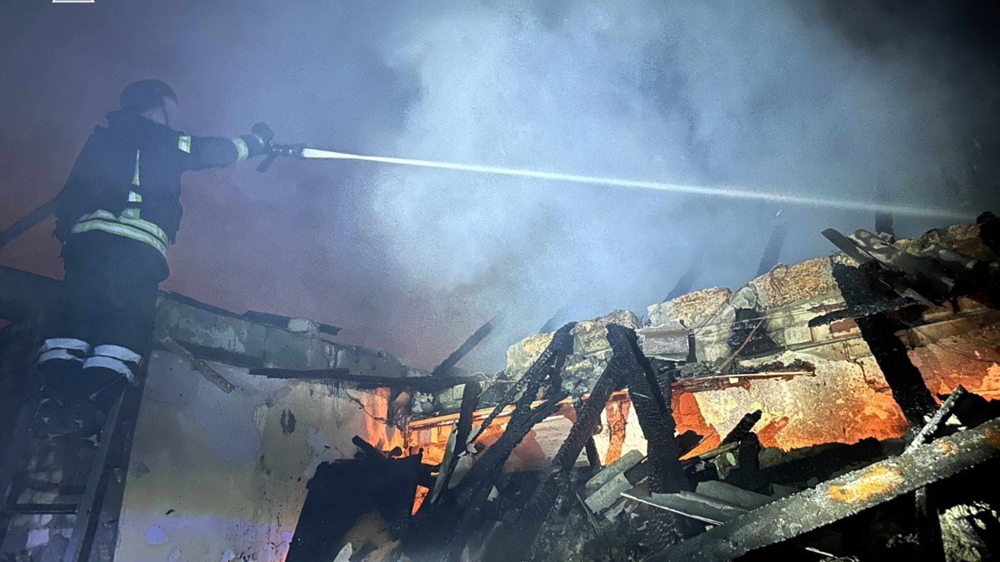 In this photo, provided by the Ukrainian Emergency Service, firefighters extinguish a fire in a residential building following a Russian drone attack in Zaporizhzhia, Ukraine, Friday, June 26, 2026. (Ukrainian Emergency Service via AP)