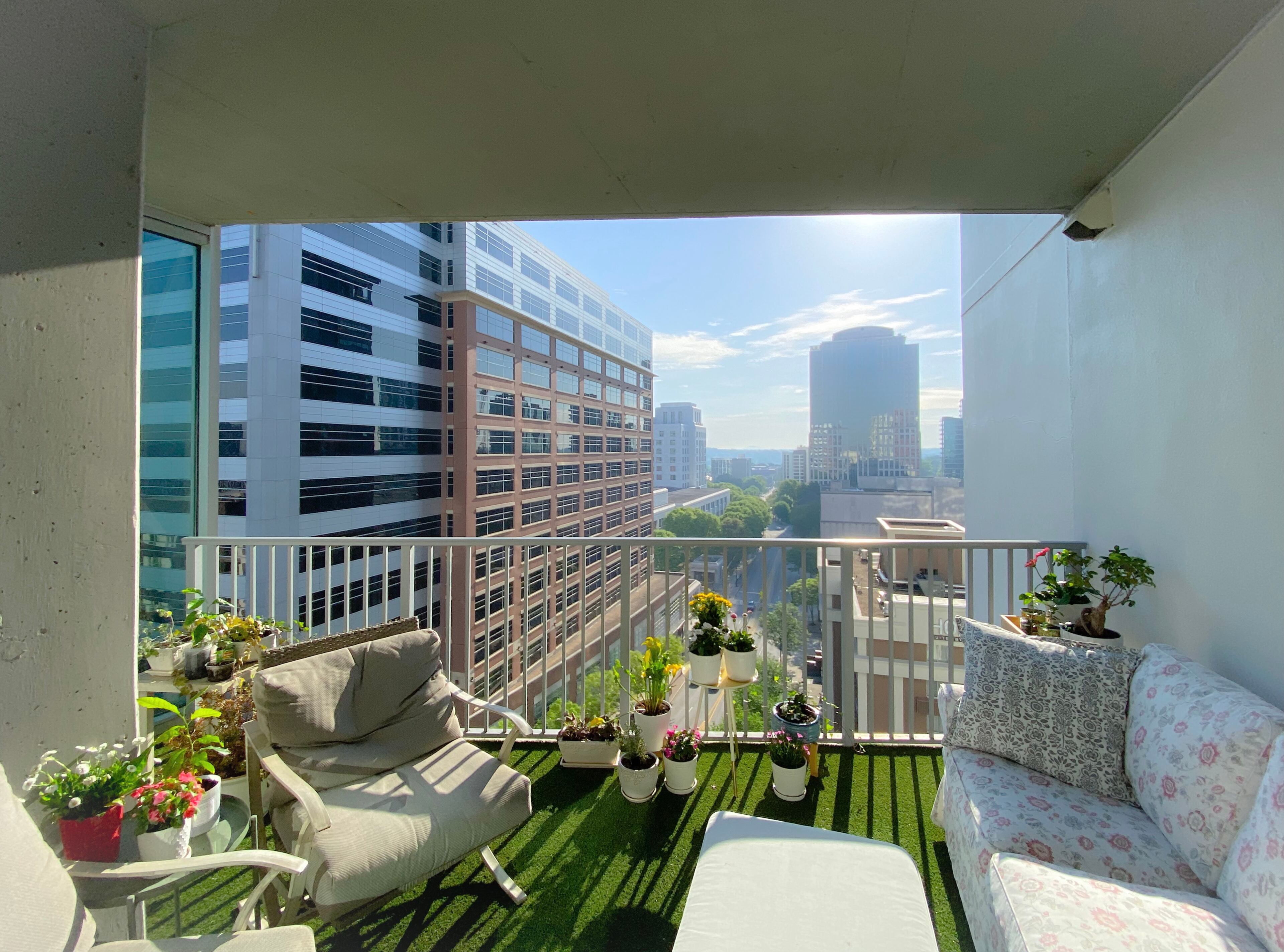 Generous balcony that takes in direct morning light and air with views of Stone Mt. Text by Eric Salsbery