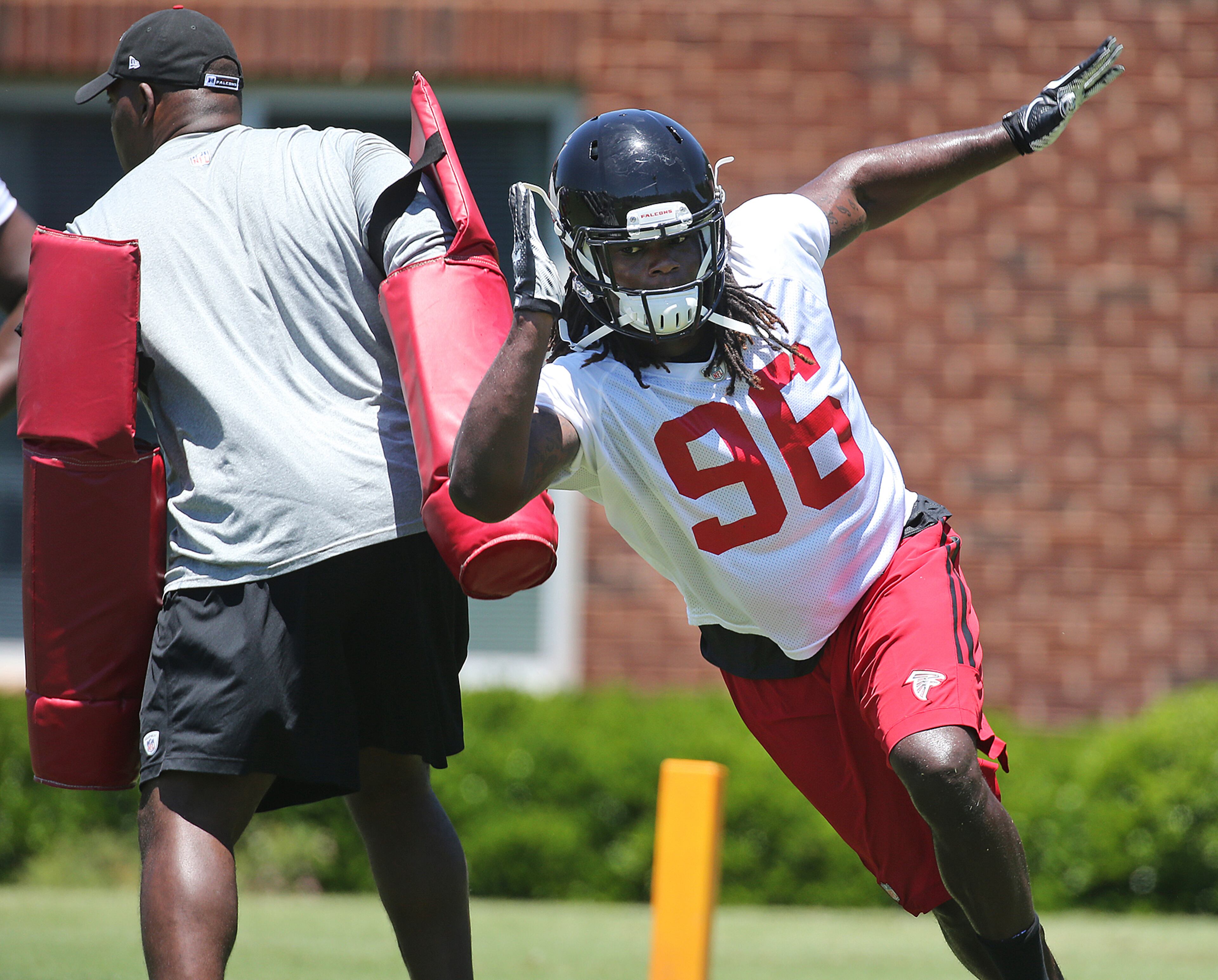 Just signed today, defensive end Nordly Capi runs a pass rushing drill during an OTA day on Tuesday, June 7, 2016, in Flowery Branch. Curtis Compton / ccompton@ajc.com
