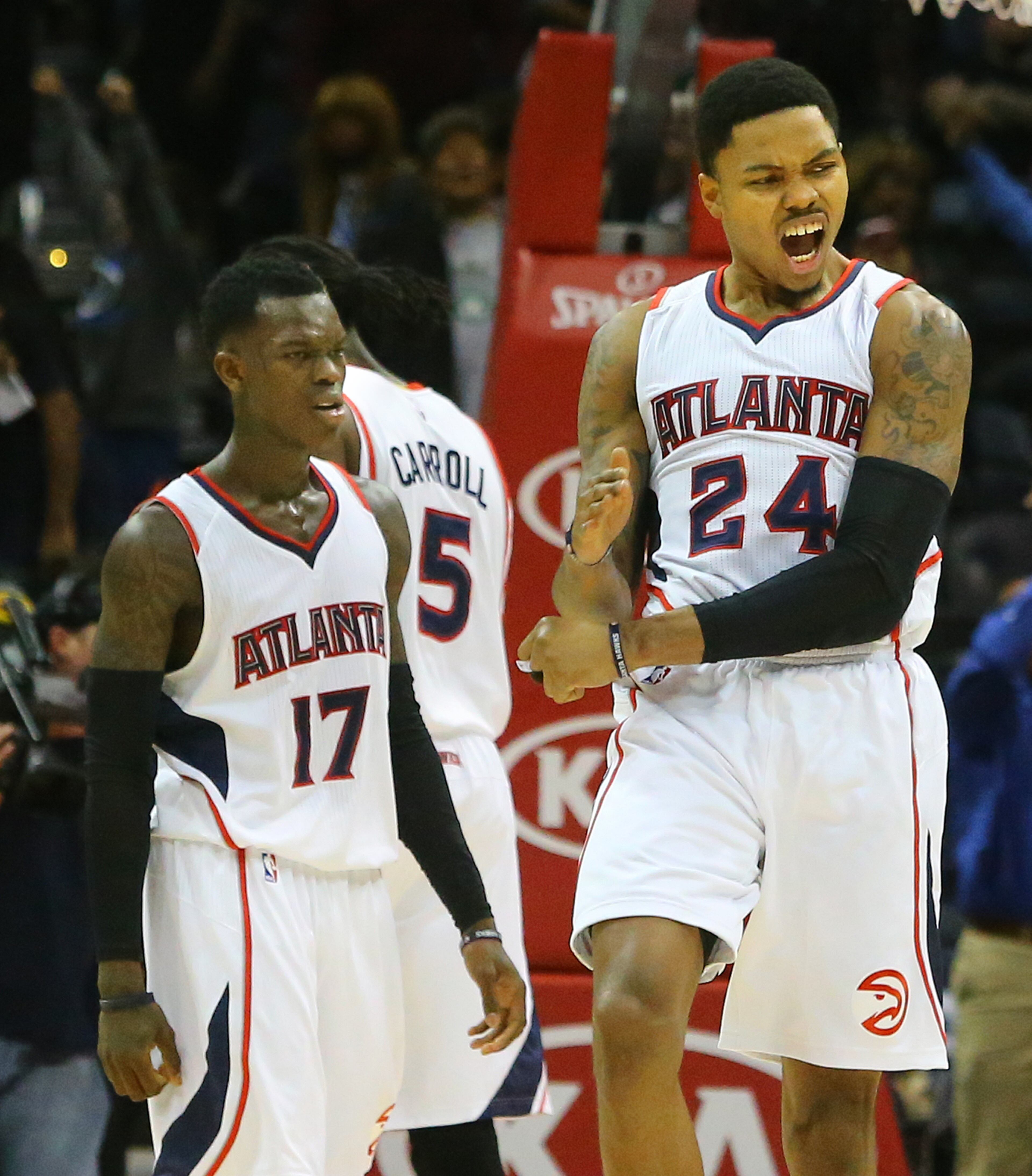 Hawks Kent Bazemore (right) and Dennis Schroder react to beating the Celtics 109-105 in an NBA basketball game on Tuesday, Dec. 2, 2014, in Atlanta. CURTIS COMPTON / CCOMPTON@AJC.COM