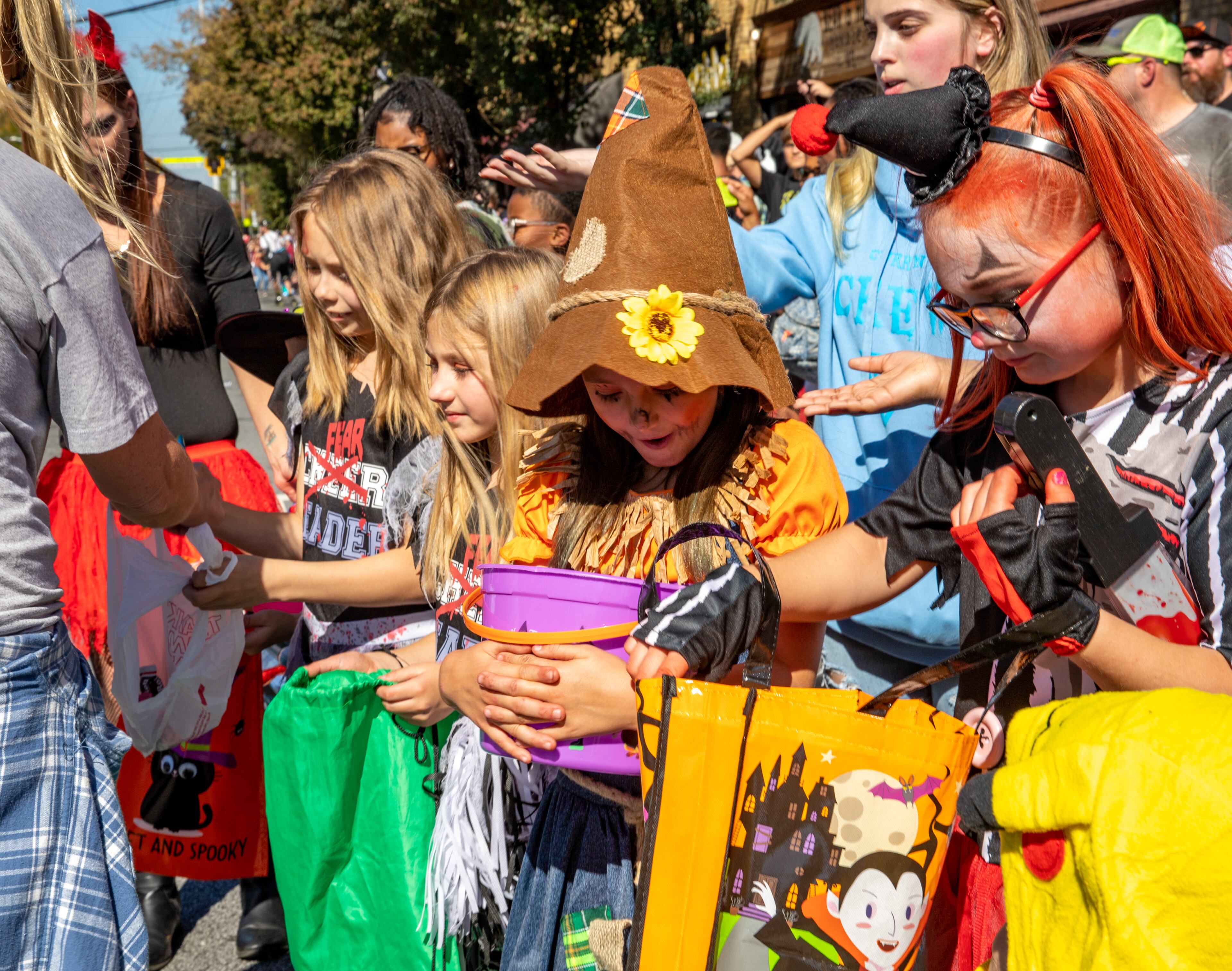 Hayden Duppree reacts when she gets candy at the annual Little Five Points Halloween Parade on Sunday, Oct 23, 2022. (Jenni Girtman for The Atlanta Journal-Constitution)