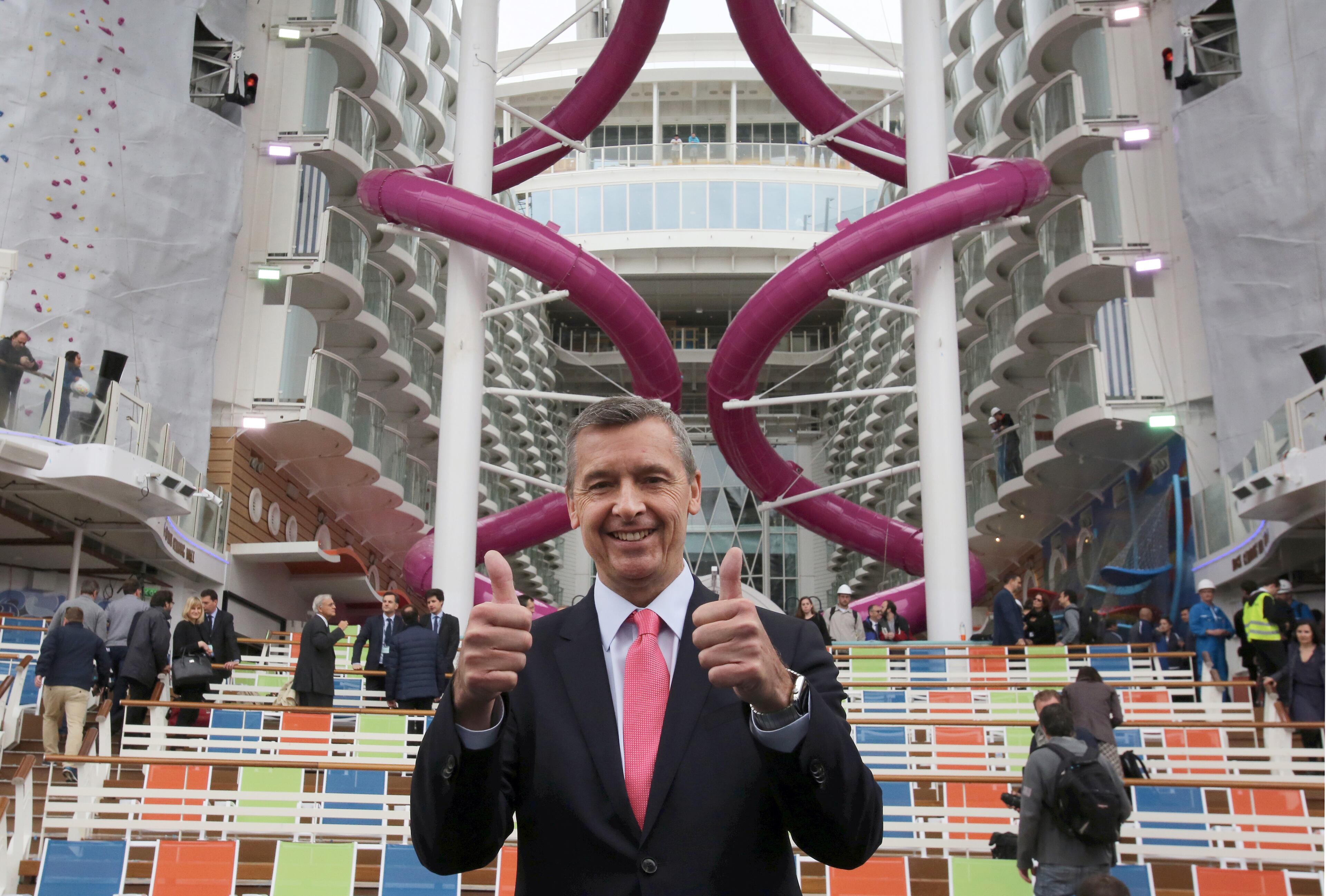 President and CEO Royal Caribbean International, Michael Bayley, gives thumbs-up as he poses for photographers during the delivery ceremony of the Harmony of the Seas class ship at the STX shipyard in Saint-Nazaire, western France, Thursday, May 12, 2016. With a capacity of 6.296 passengers and 2.384 crew members, the Harmony of the Seas, built by STX France for the Royal Caribbean International, is the world's largest ship cruise. (AP Photo/Laetitia Notarianni)