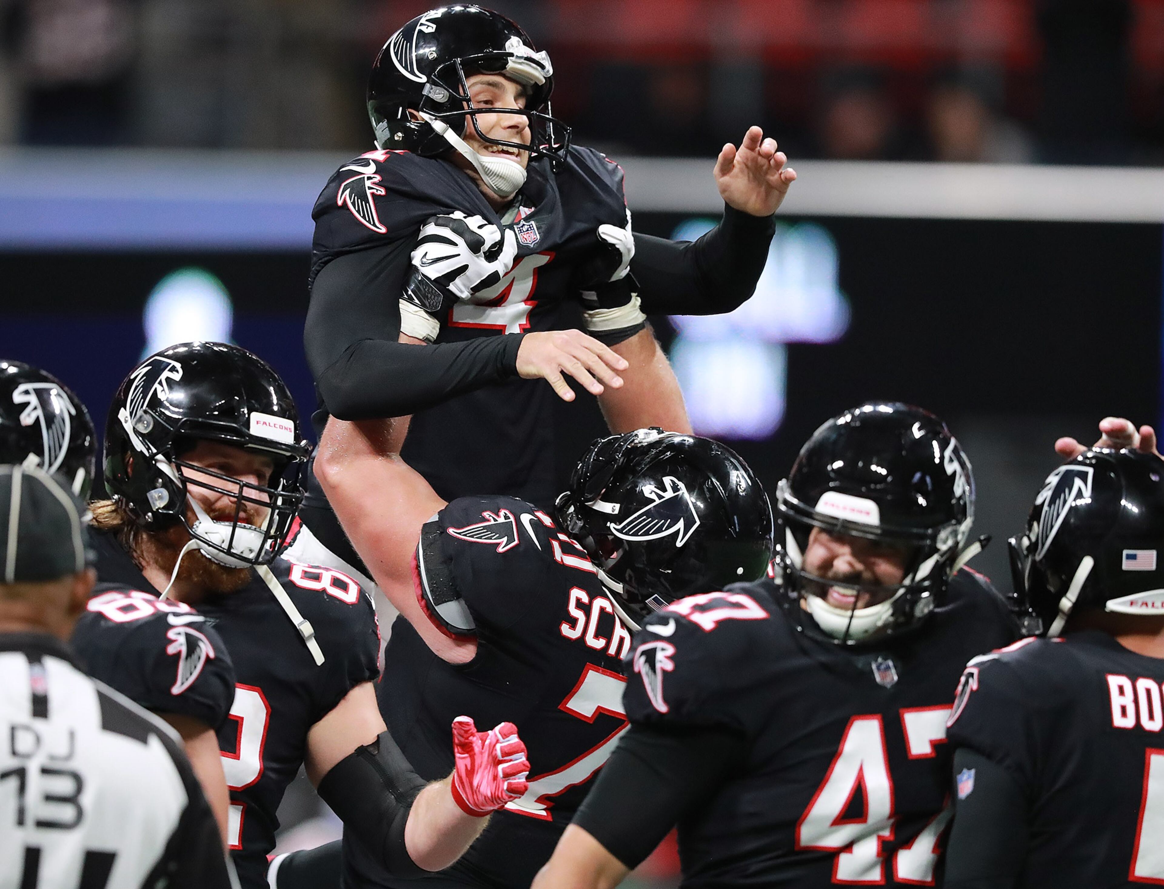 Atlanta Falcons offensive lineman Ryan Schraeder hoists replacement kicker Giorgio Tavecchio in the air after his third field goal of the game for a 23-12 lead over the New York Giants during the fourth quarter in a NFL football game on Monday, Oct 22, 2018, in Atlanta. The kick proved to be the difference in the game for a 23-20 Falcons victory. Curtis Compton/ccompton@ajc.com