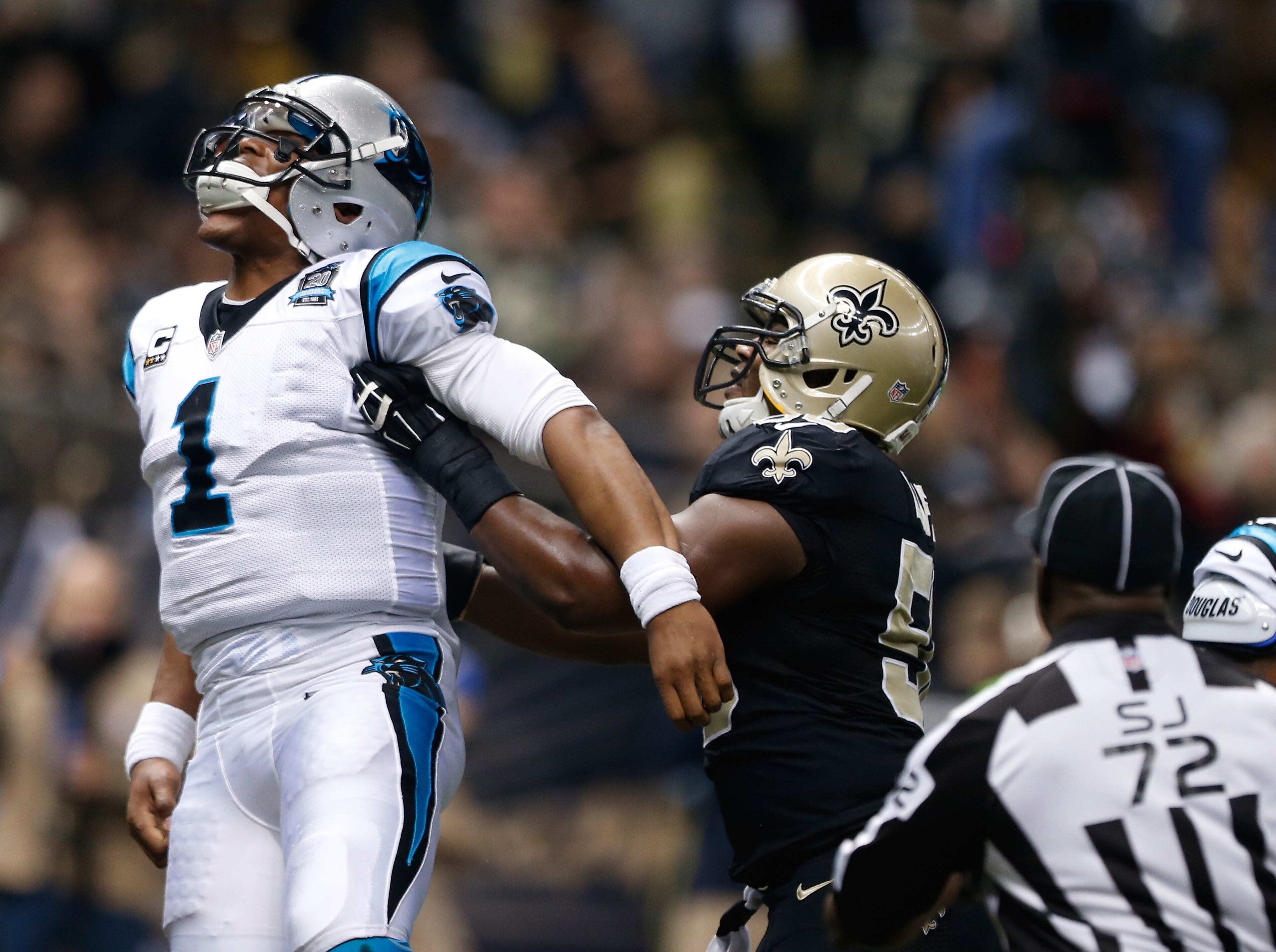 Cam Newton #1 of the Carolina Panthers and Curtis Lofton #50 of the New Orleans Saints scuffle after a touchdown during the first quarter at Mercedes-Benz Superdome on December 7, 2014 in New Orleans, Louisiana. (Photo by Sean Gardner/Getty Images)