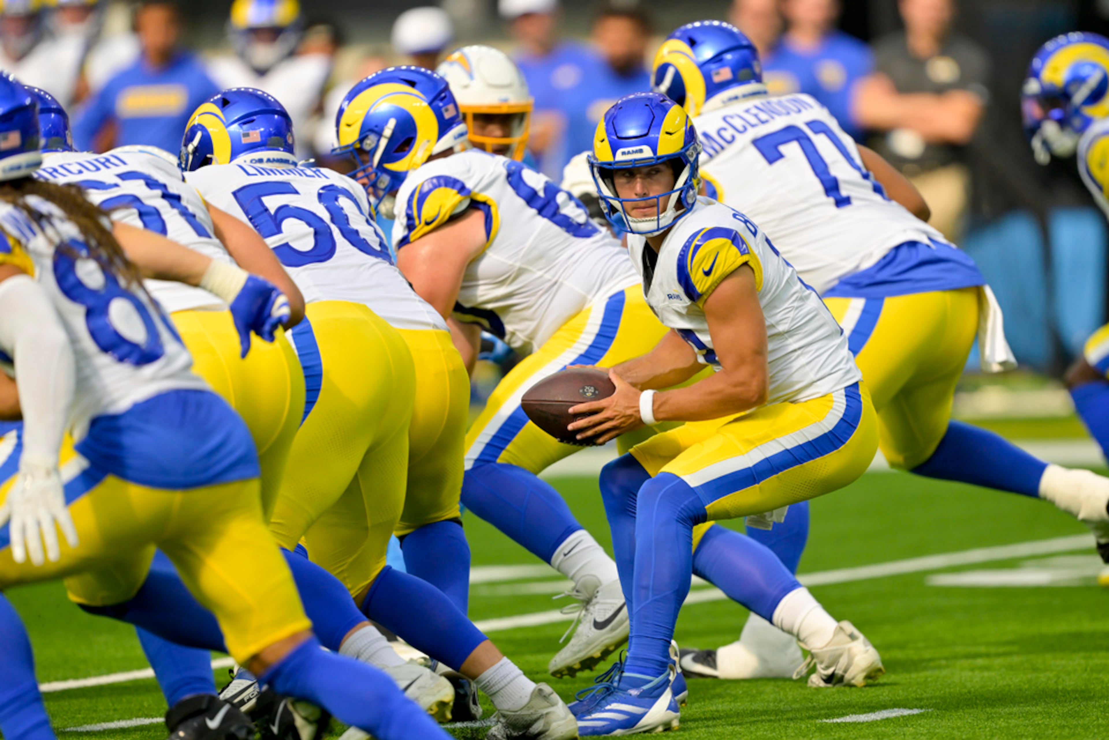 Los Angeles Rams quarterback Stetson Bennett takes a snap during the first half of a preseason NFL football game against the Los Angeles Rams, Saturday, Aug. 17, 2024, in Inglewood, Calif. (AP Photo/Jayne Kamin-Oncea)
