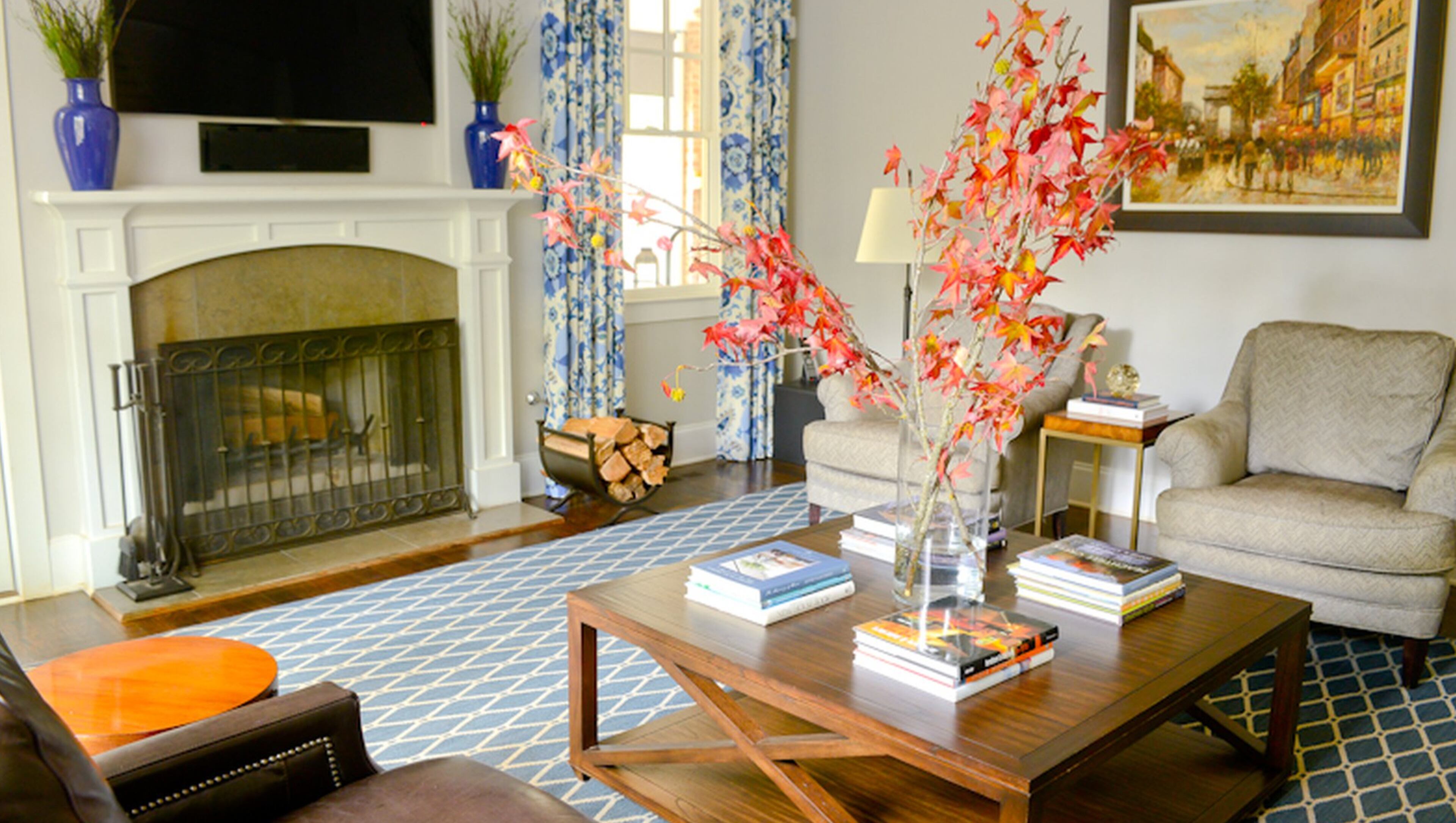 Red and orange leaves add a splash of fall color to the great room. Homeowners Brian and Angela Fisher used soothing wall colors on the main level to create a sense of calm — something they felt was essential with their three kids and bustling lifestyle. The furniture and rug were sourced from the Atlanta Decorative Arts Center (ADAC). Text by Lori Johnston and Shannon Adams/Fast Copy News Service. (Christopher Oquendo Photography/www.ophotography.com)
