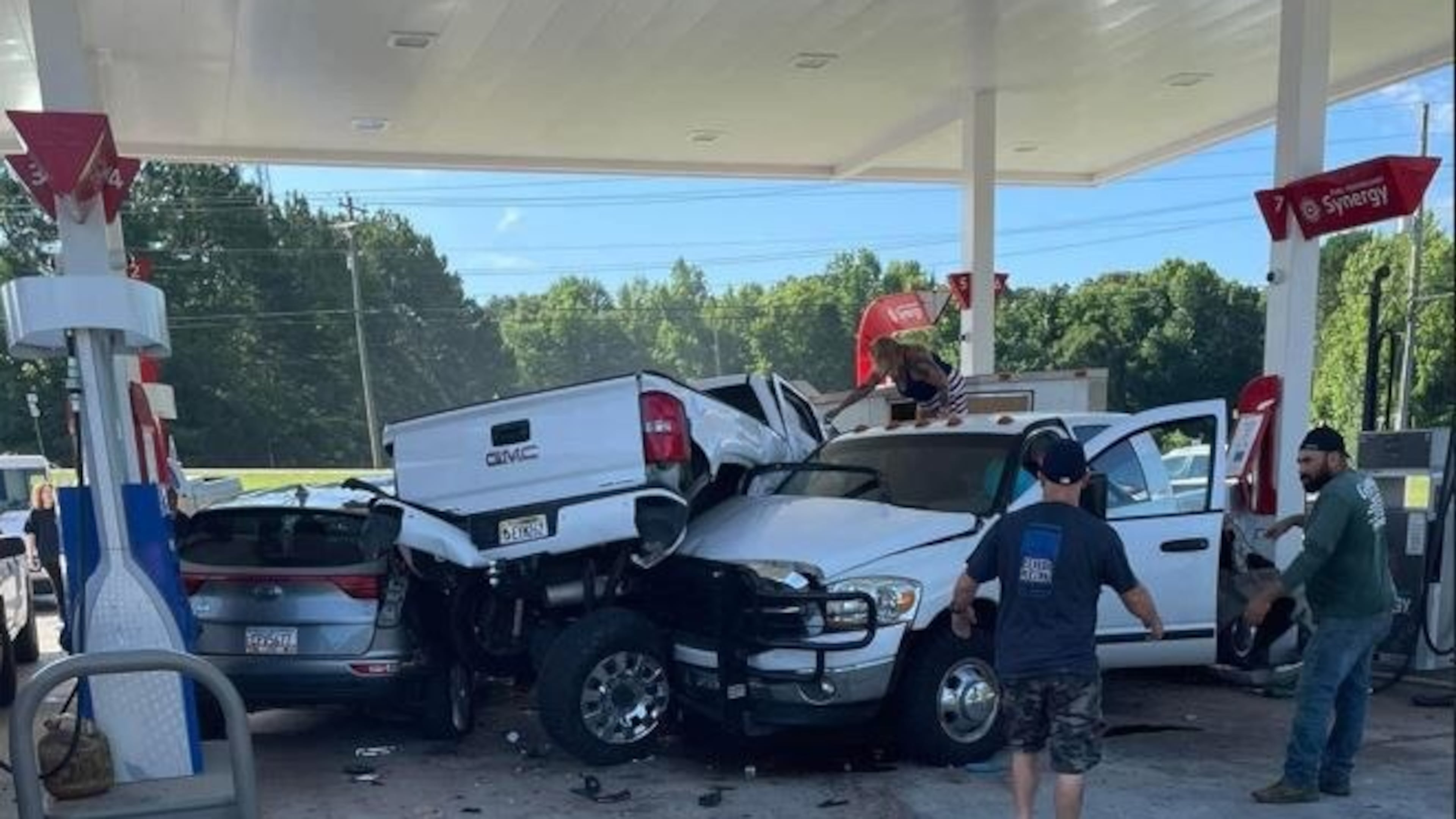 Several people were injured Sunday when a man crashed at a Paulding County gas station and then shot himself, according to investigators.