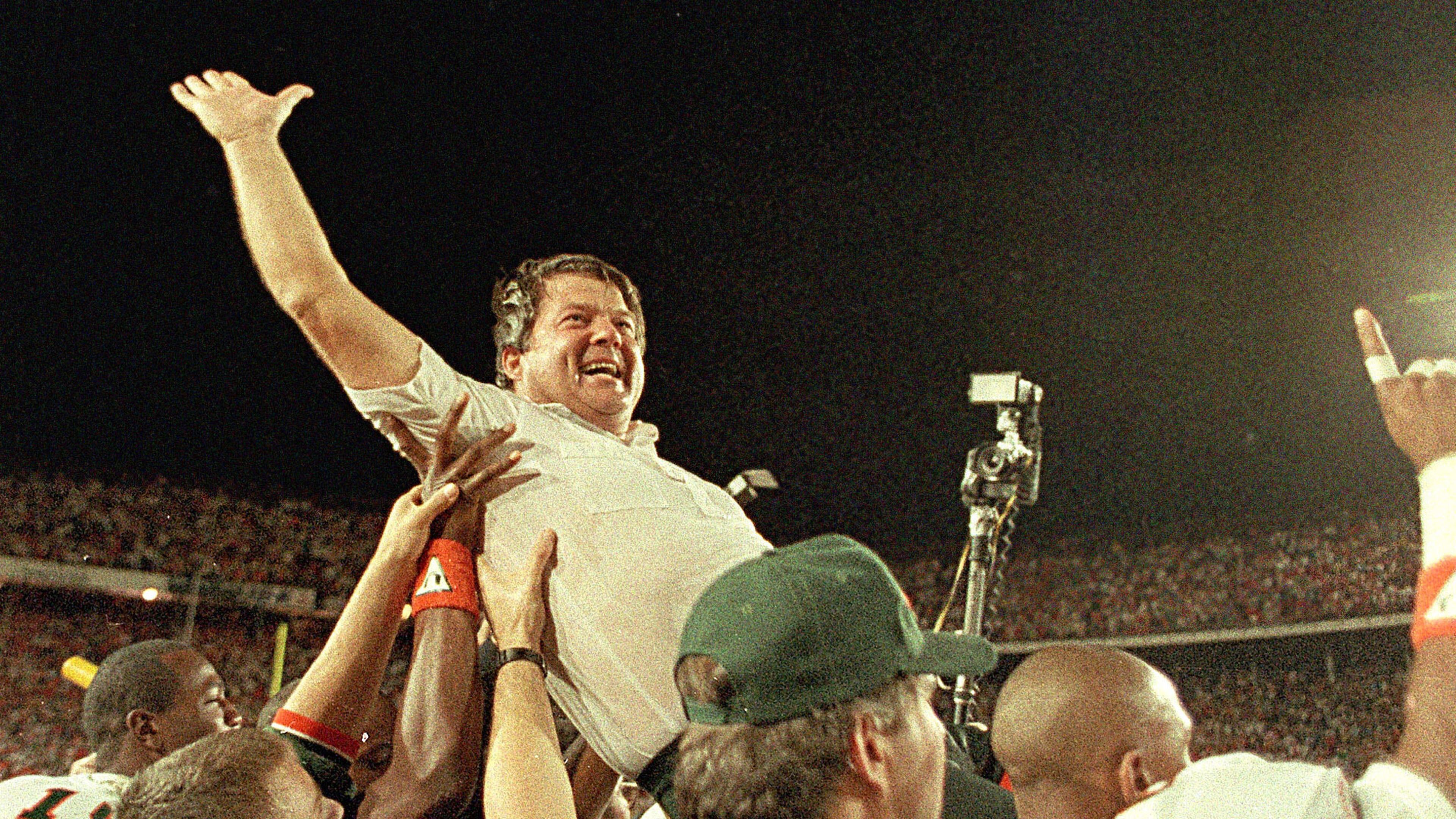 FILE - In this Jan. 1, 1988, file photo, University of Miami coach Jimmy Johnson is carried from the field by his players after the Hurricanes defeated the Oklahoma 20-14 in the Orange Bowl Classic, in Miami. (AP Photo/Raul Demolina, File)