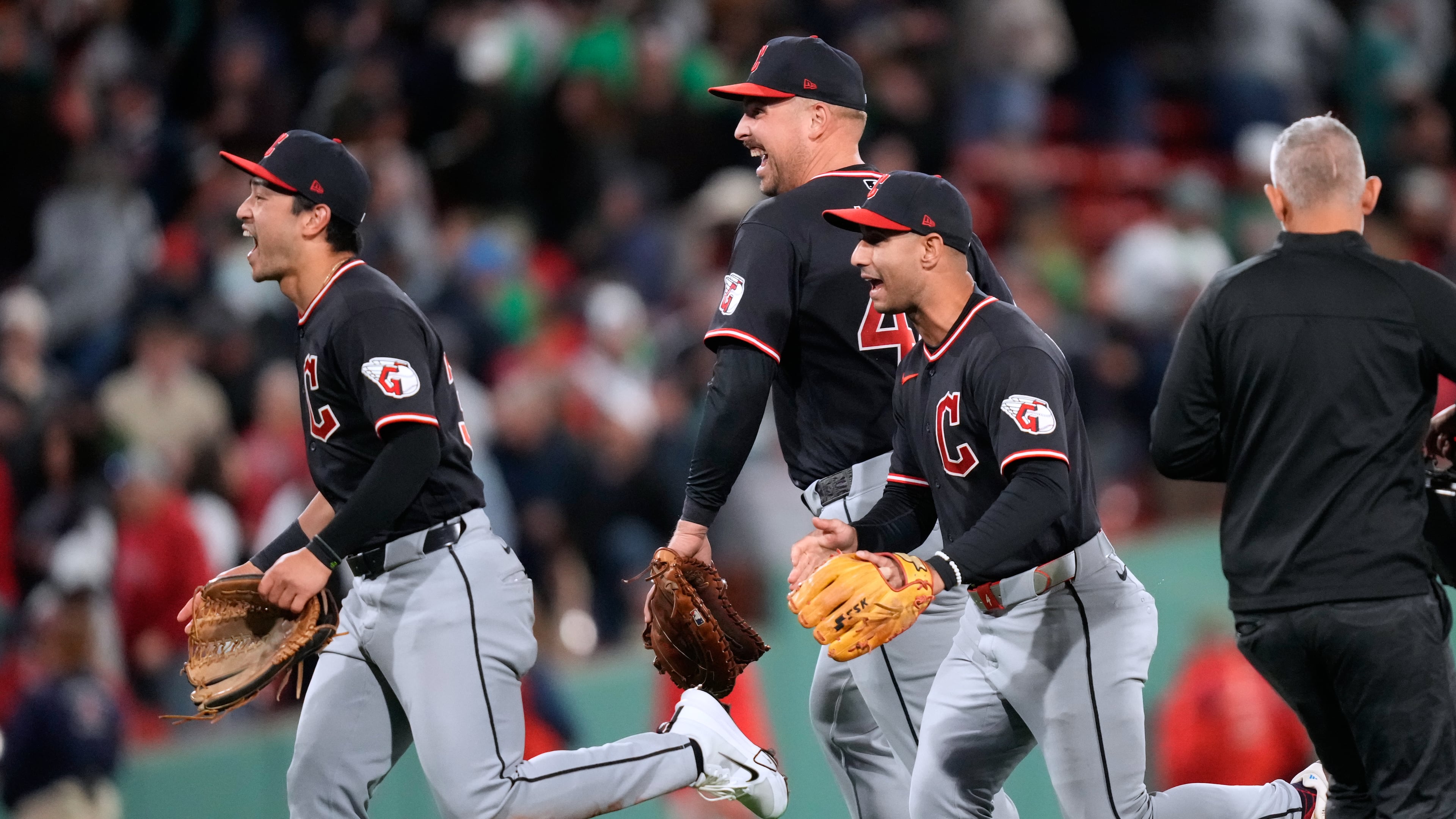 Cleveland Guardians' Nathaniel Lowe, center, celebrates with teammates after defeating the Boston Red Sox following a baseball game, Tuesday, Sept. 22, 2026, in Boston. (AP Photo/Charles Krupa)