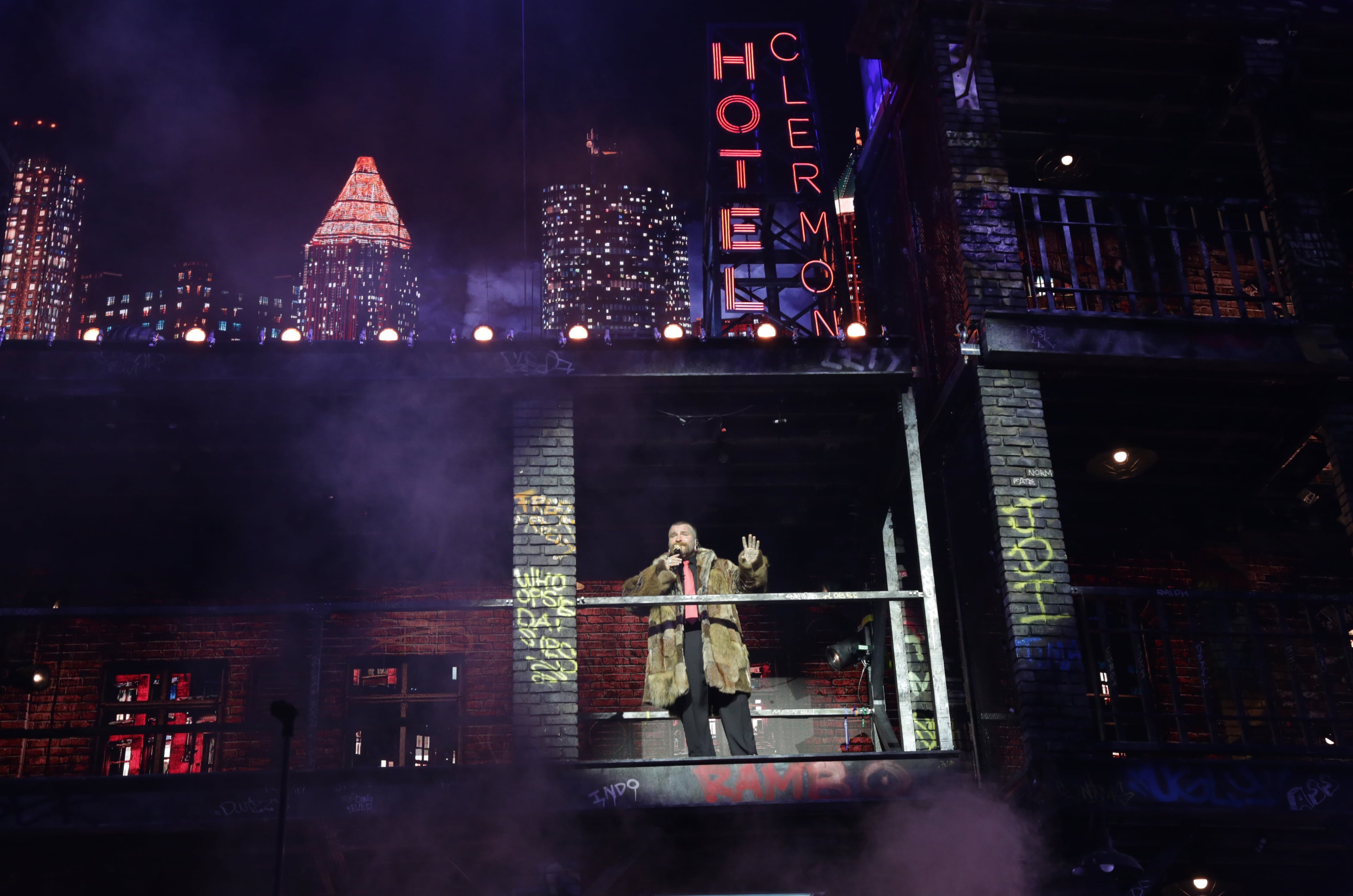 Hotel Clermont signage is visible on Teddy Swims' Atlanta-inspired cityscape stage. (Akili-Casundria Ramsess for the AJC)