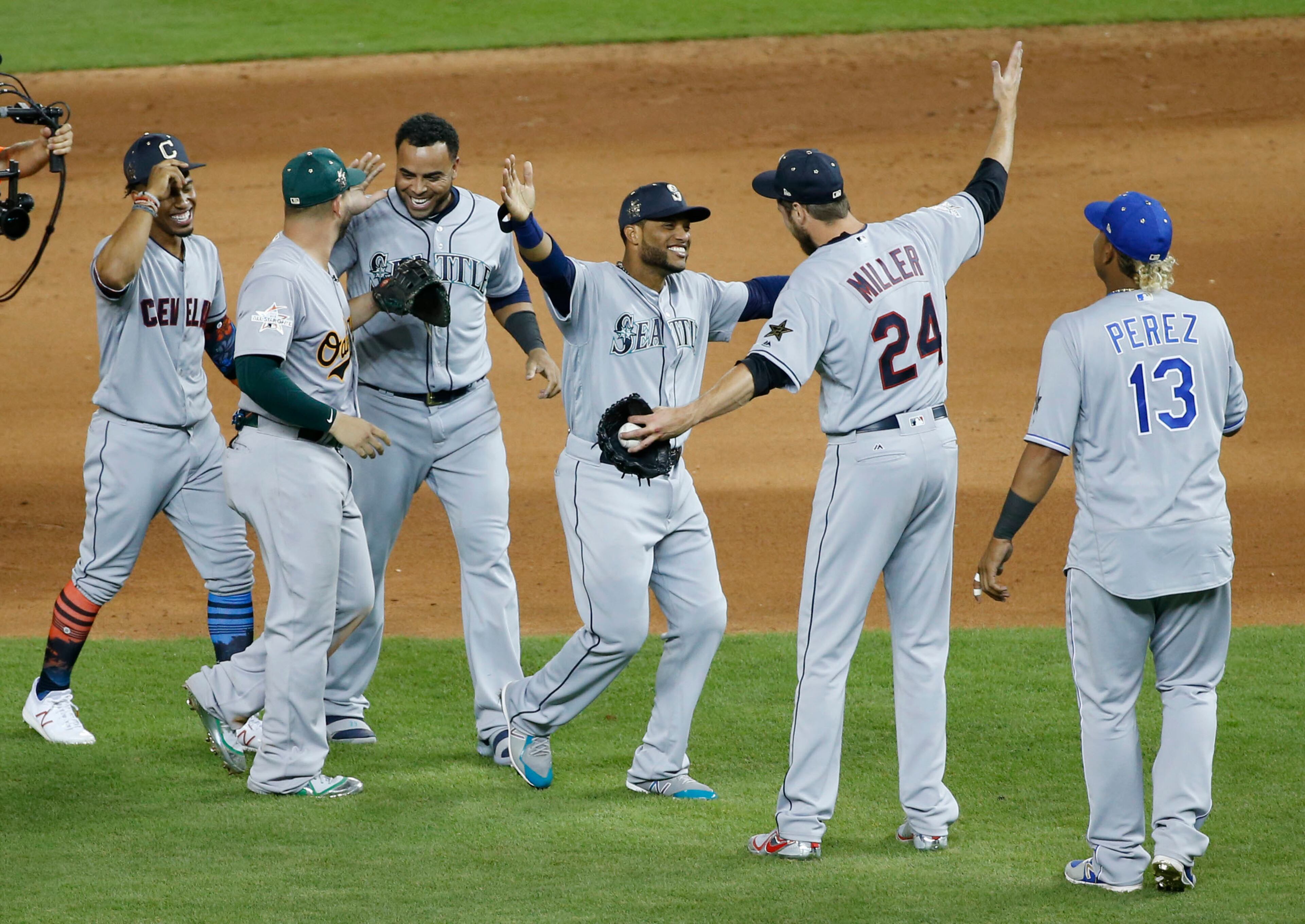 American League teammates celebrate winning the MLB baseball All-Star Game, Tuesday, July 11, 2017, in Miami. The American League defeated the National League 2-1 in ten innings. Seattle Mariners Robinson Cano (22), third from right, hit the game winning home run. (AP Photo/Wilfredo Lee)