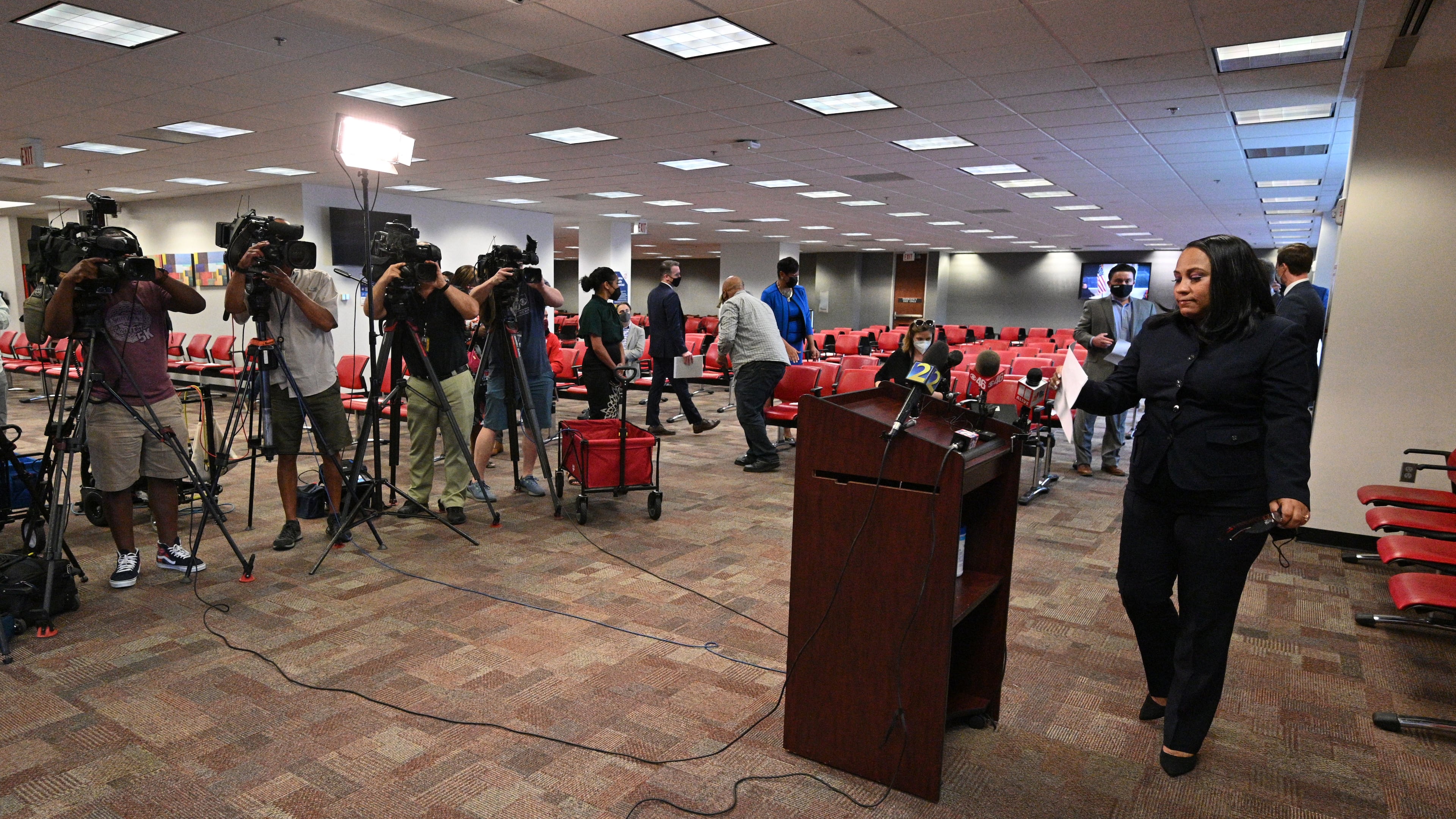 May 11, 2021 Atlanta - Fulton County's district attorney Fani Willis walks to the podium before she speaks to members of press during a press conference on indictment of Atlanta spa shooting suspect Robert Long at Fulton County Courthouse Judicial Center Tower on Tuesday, May 11, 2021. Eight weeks after eight people were killed at three metro Atlanta spas, a Fulton County grand jury has indicted the alleged gunman, the District Attorney’s Office said Tuesday. Prosecutors also plan to seek the death penalty and pursue hate crime charges, according to court filings. (Hyosub Shin / Hyosub.Shin@ajc.com)