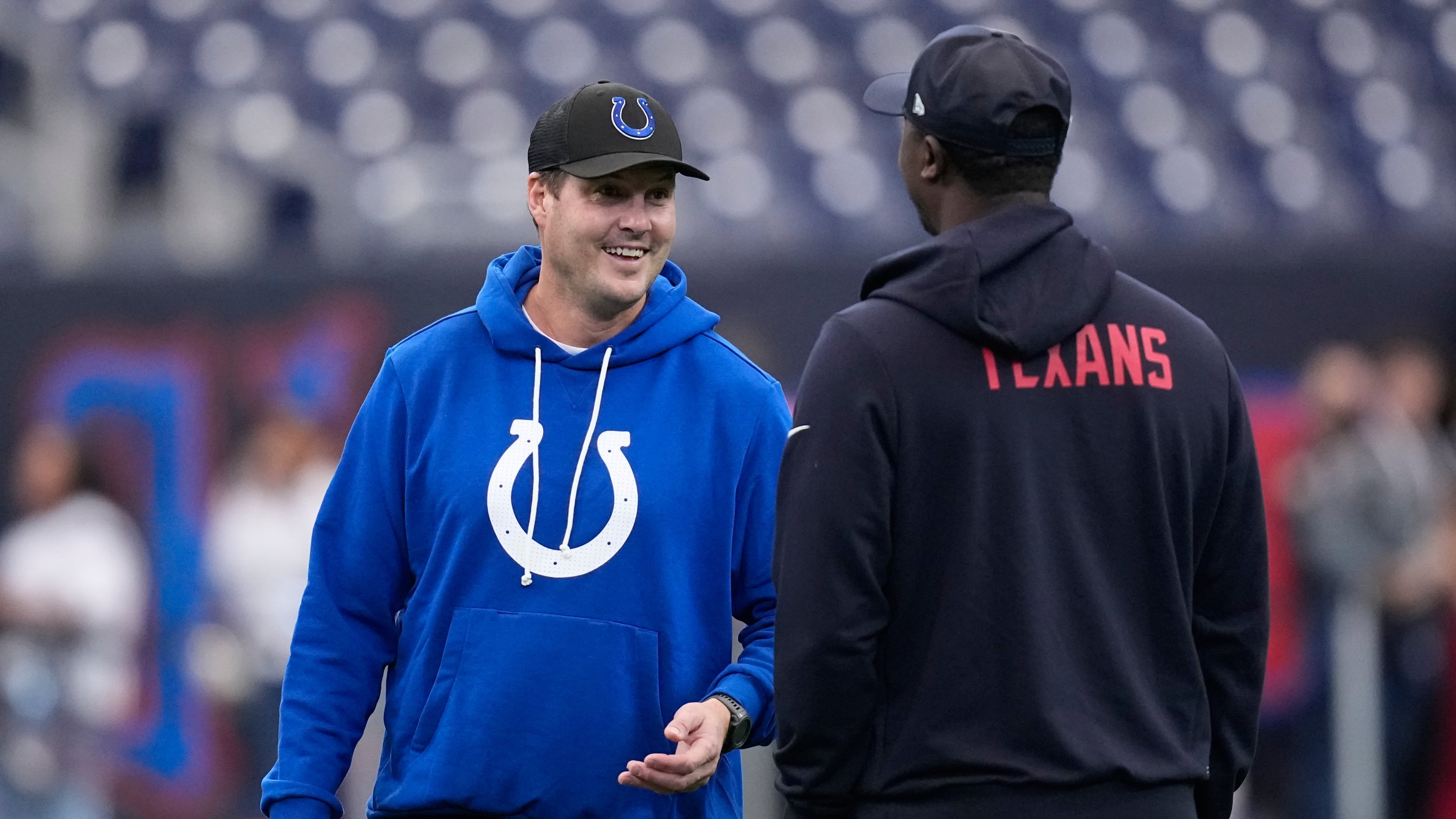 Indianapolis Colts quarterback Philip Rivers, left, visits before an NFL football game against the Houston Texans in Houston, Sunday, Jan. 4, 2026. (AP Photo/David J. Phillip)
