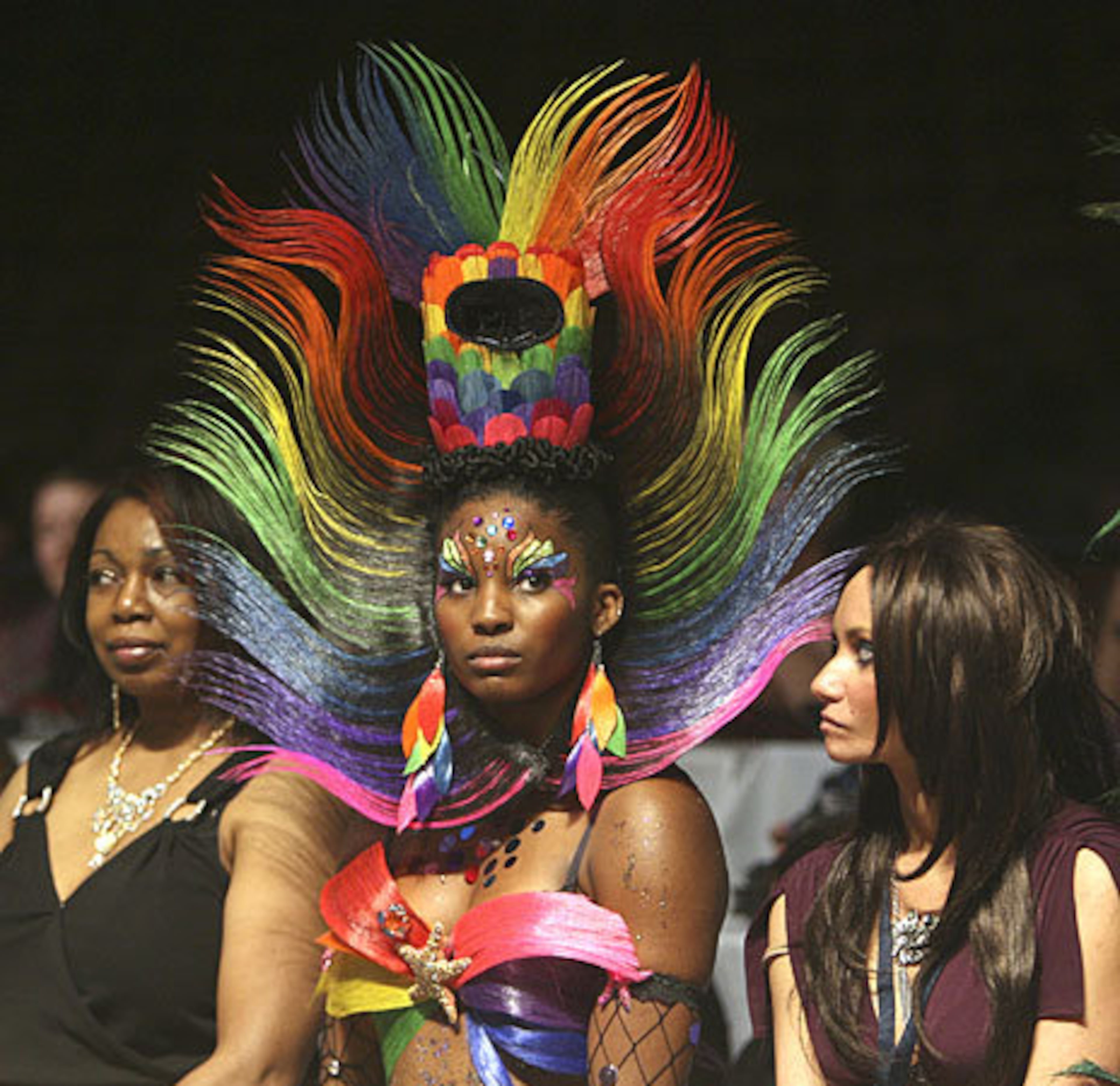 Model Taneeka Hamilton waits with her hair design by Stephanie Moye of Moye Hair Ect from Pittsburgh, Pa., as winners are announced.
