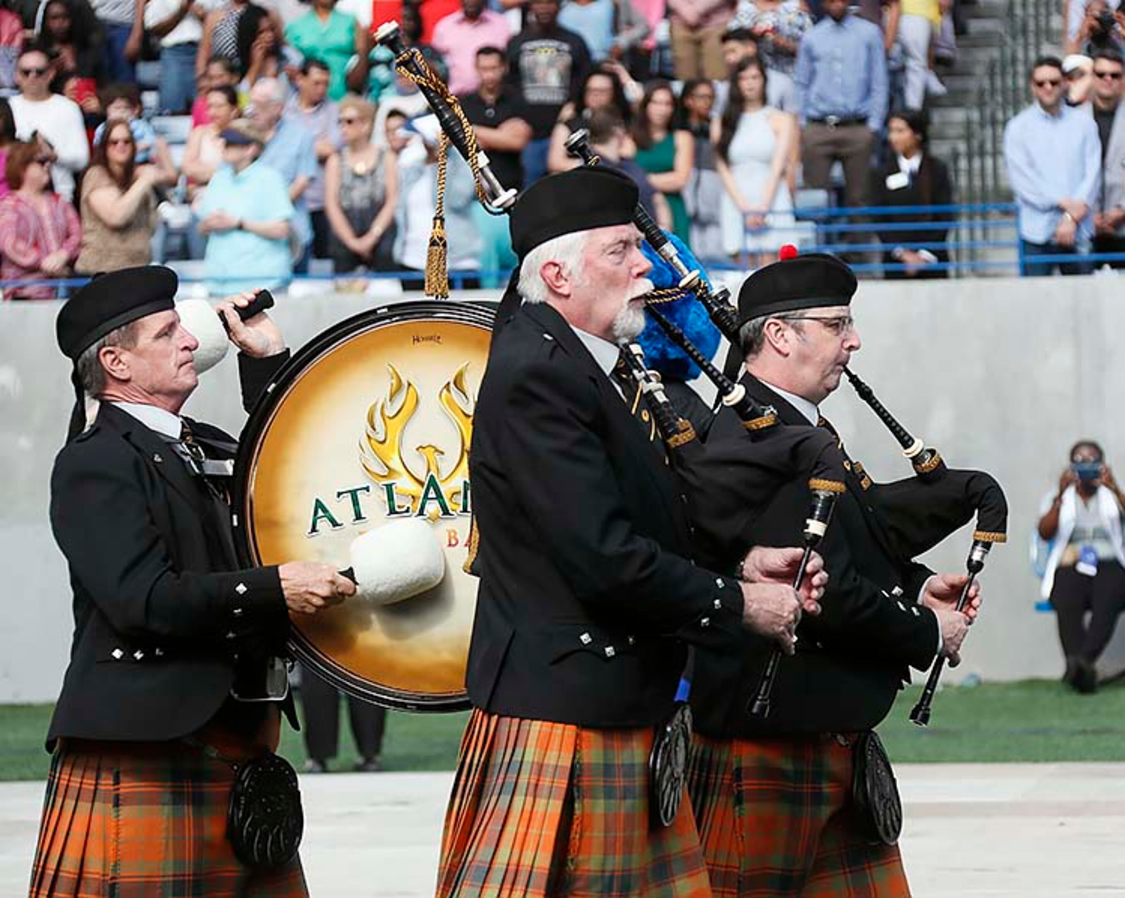 May 9, 2019 - Atlanta - The Atlanta Pipe Band lead the platform party into the ceremony. Georgia State University is hosting its 104th Commencement Monday, May 6 through Tuesday, May 14 at Panther Stadium in Atlanta. Six schools held their graduation on Thursday. Bob Andres / bandres@ajc.com