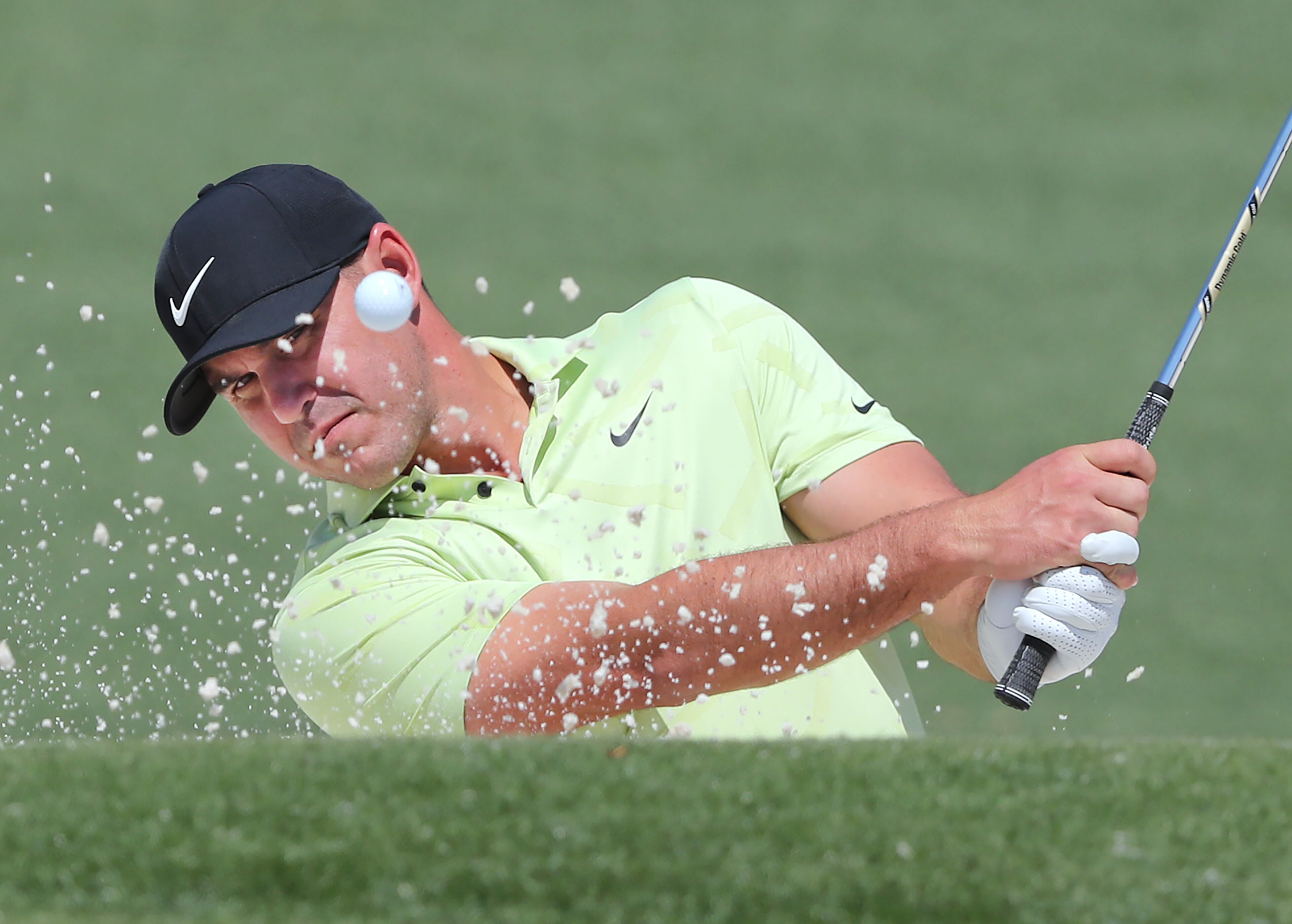 Brooks Koepka hits his bunker shot to the second green during his practice round for the Masters at Augusta National Golf Club on Tuesday, April 6, 2021, in Augusta. “Curtis Compton / Curtis.Compton@ajc.com”