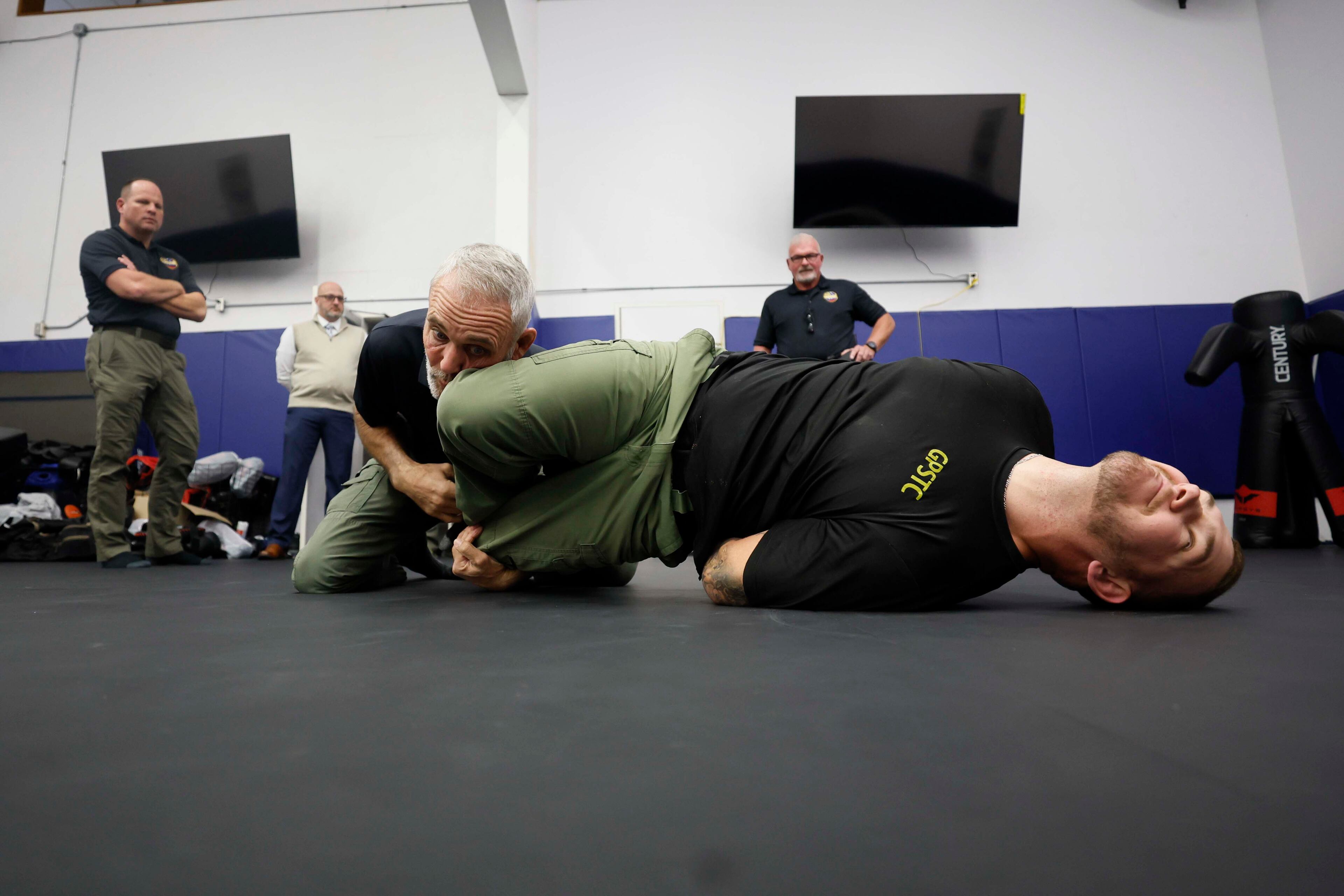 Casey Baynes, a use-of-force instructor, works with Garrett Yates as he demonstrates how to immobilize a person during a session on arrest and restraint procedures at the Georgia Public Safety Training Center on October 23, 2025, in Forsyth.
(Miguel Martinez/ AJC)