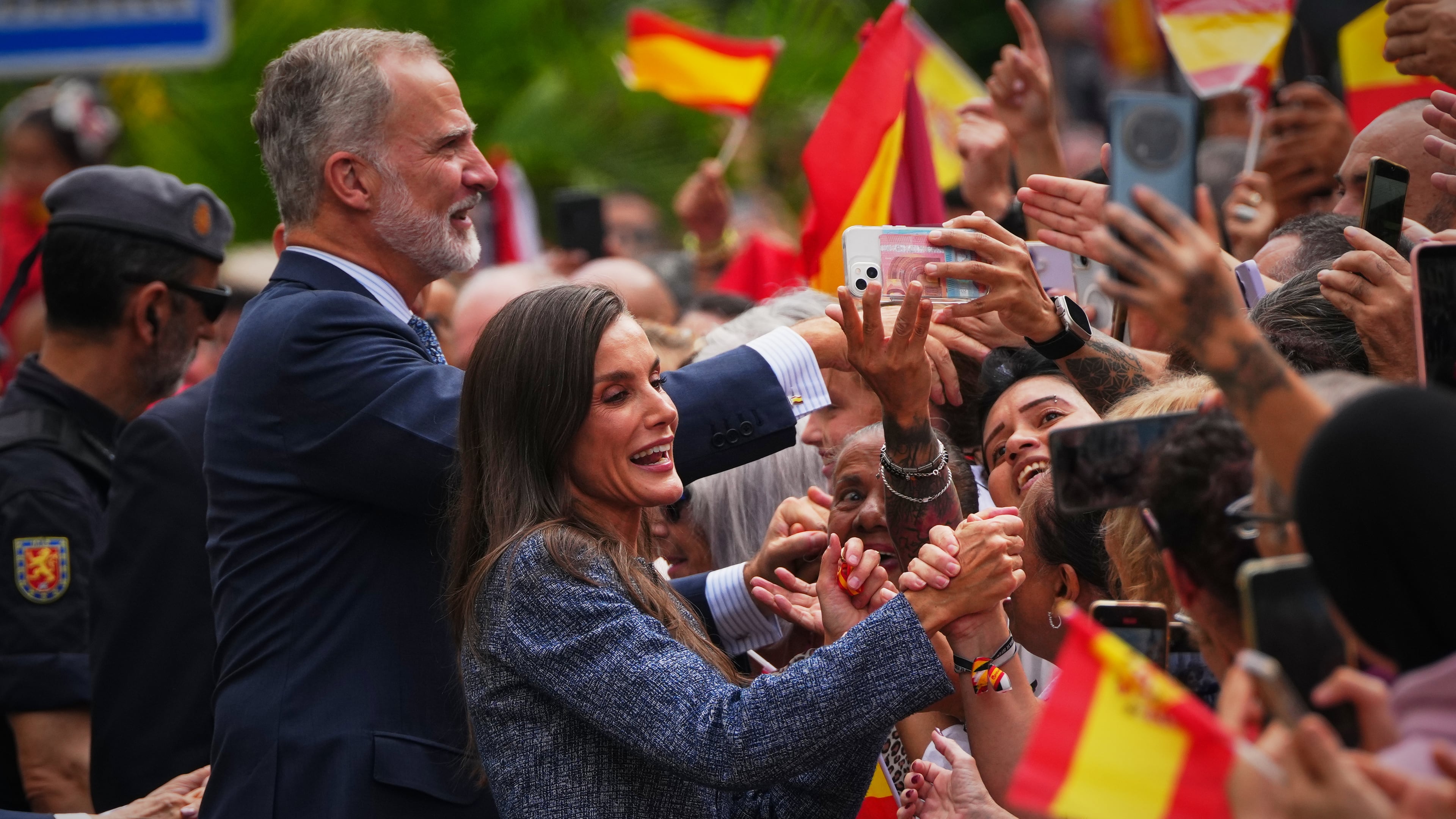 Spain's King Felipe VI and Queen Letizia greet the crowd during their visit to the Spanish enclave of Ceuta, Tuesday, Oct. 13, 2026. (AP Photo/Manu Fernández)