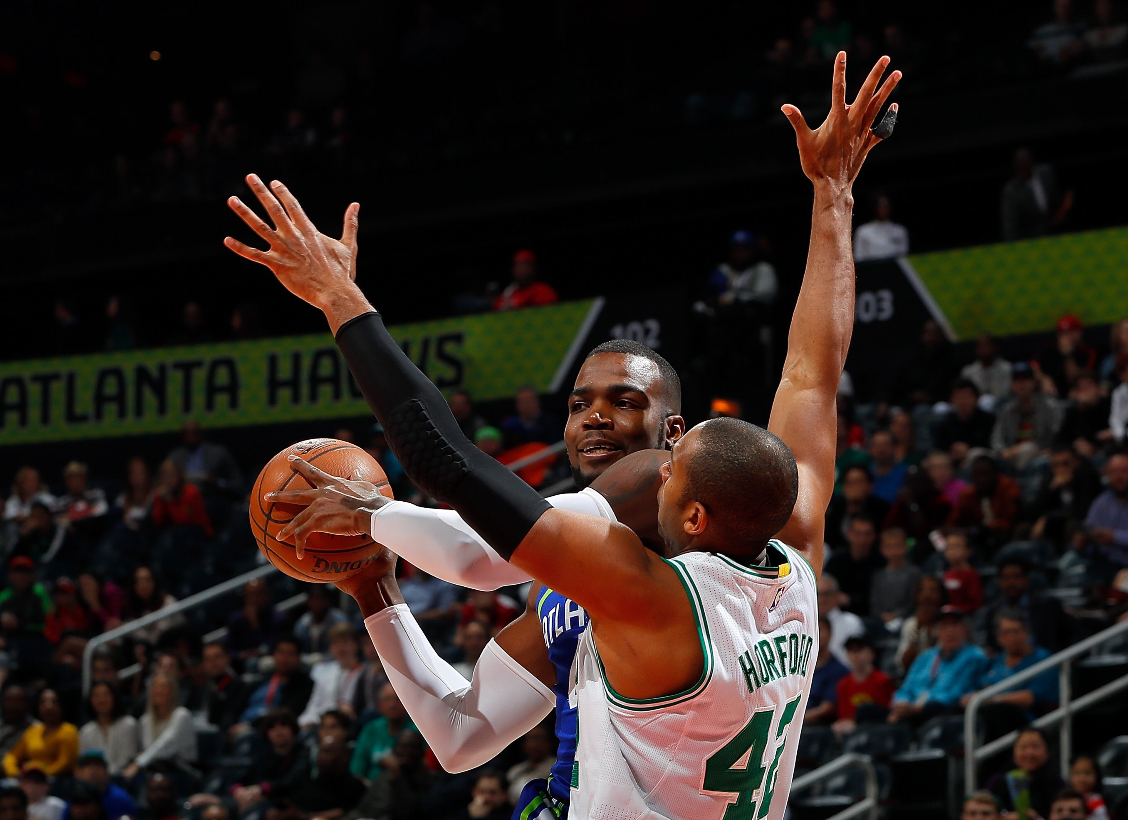 ATLANTA, GA - JANUARY 13: Al Horford #42 of the Boston Celtics defends against Paul Millsap #4 of the Atlanta Hawks at Philips Arena on January 13, 2017 in Atlanta, Georgia. NOTE TO USER User expressly acknowledges and agrees that, by downloading and or using this photograph, user is consenting to the terms and conditions of the Getty Images License Agreement. (Photo by Kevin C. Cox/Getty Images)