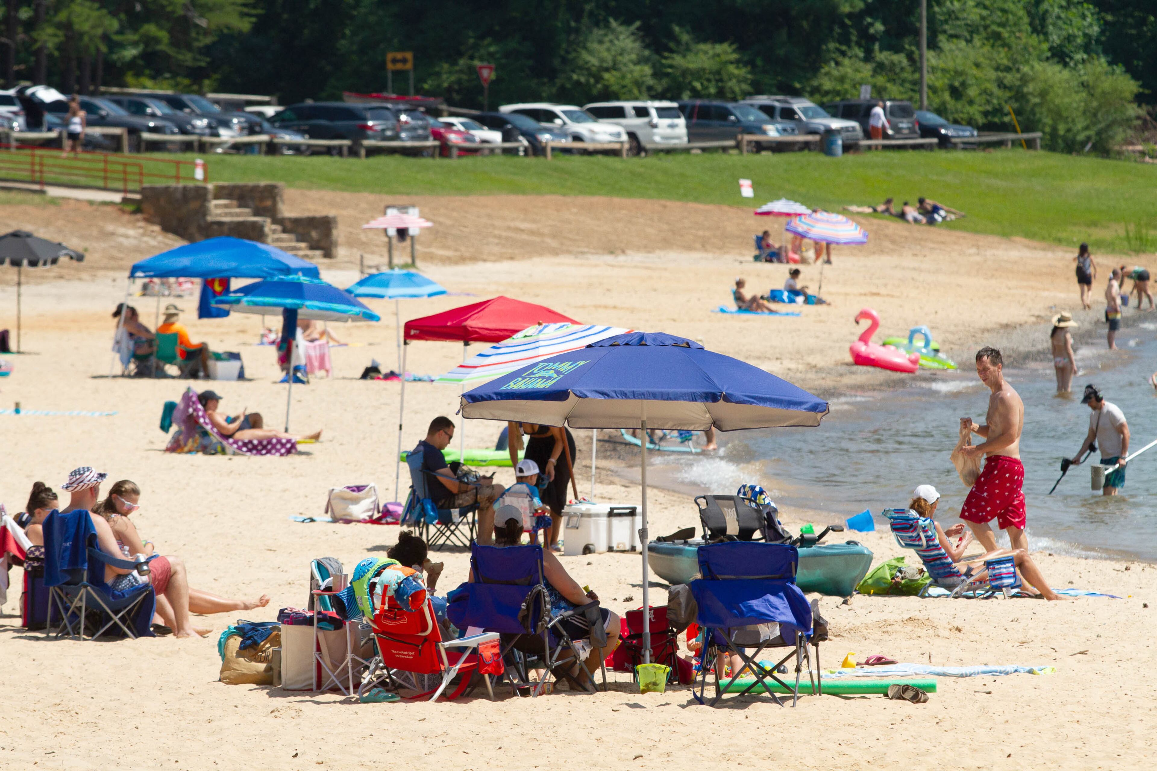People enjoy the beach on a hot Sunday afternoon at Mary Alice Beach Park in Lake Lanier on Sunday, July 5, 2020. STEVE SCHAEFER FOR THE ATLANTA JOURNAL-CONSTITUTION