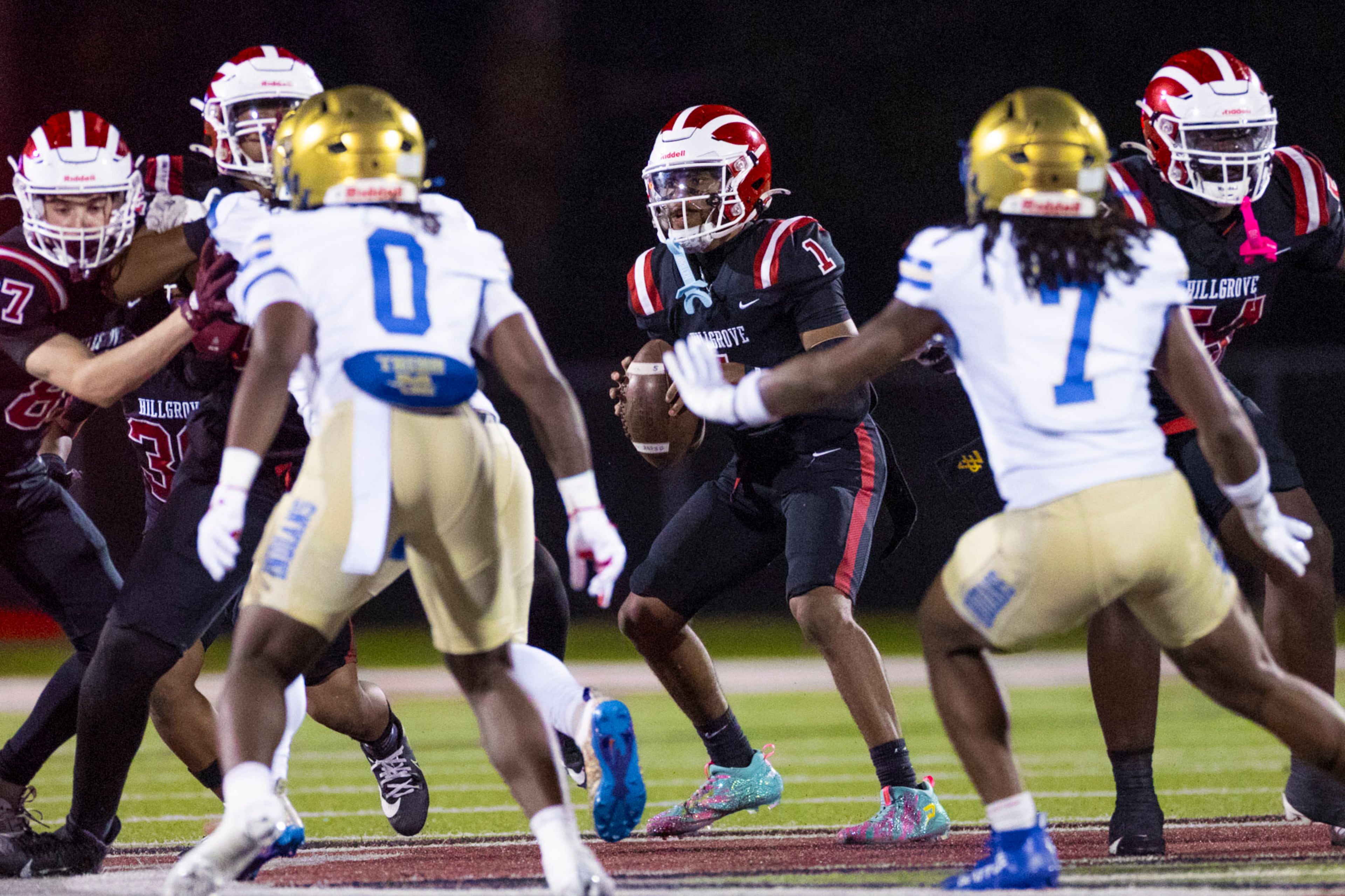 Hillgrove quarter back Donovan Mack (center) prepares to throw against McEachern at Cobb Energy Hillgrove Stadium in Powder Springs, GA on Friday, Oct. 17th, 2025. (Oscar Guevara Saenz for the AJC)