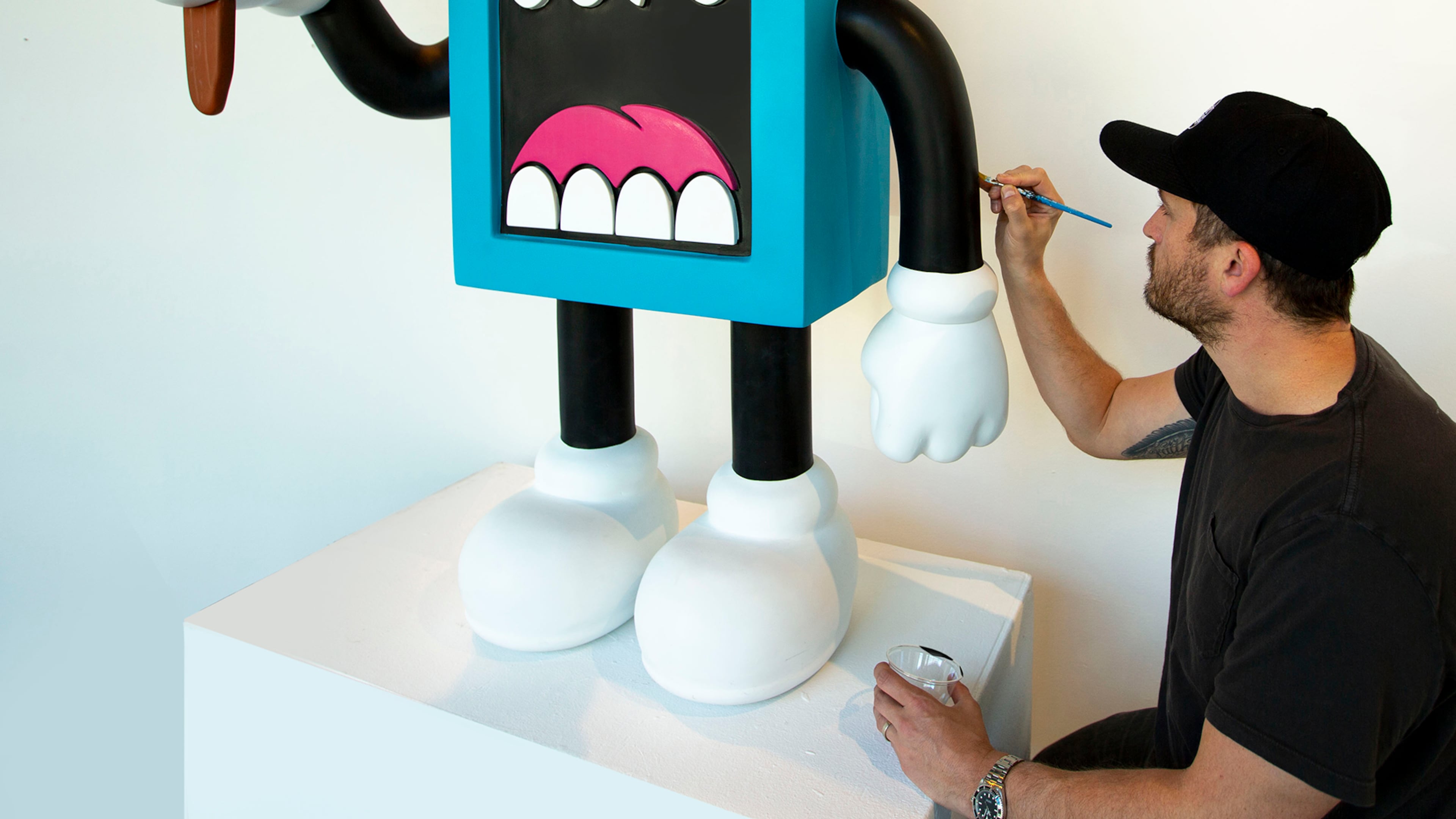 Artist Greg Mike's iconic creation Larry Loudmouf, rendered here as a sculpture, can be seen on walls throughout the city. Courtesy of Greg Mike