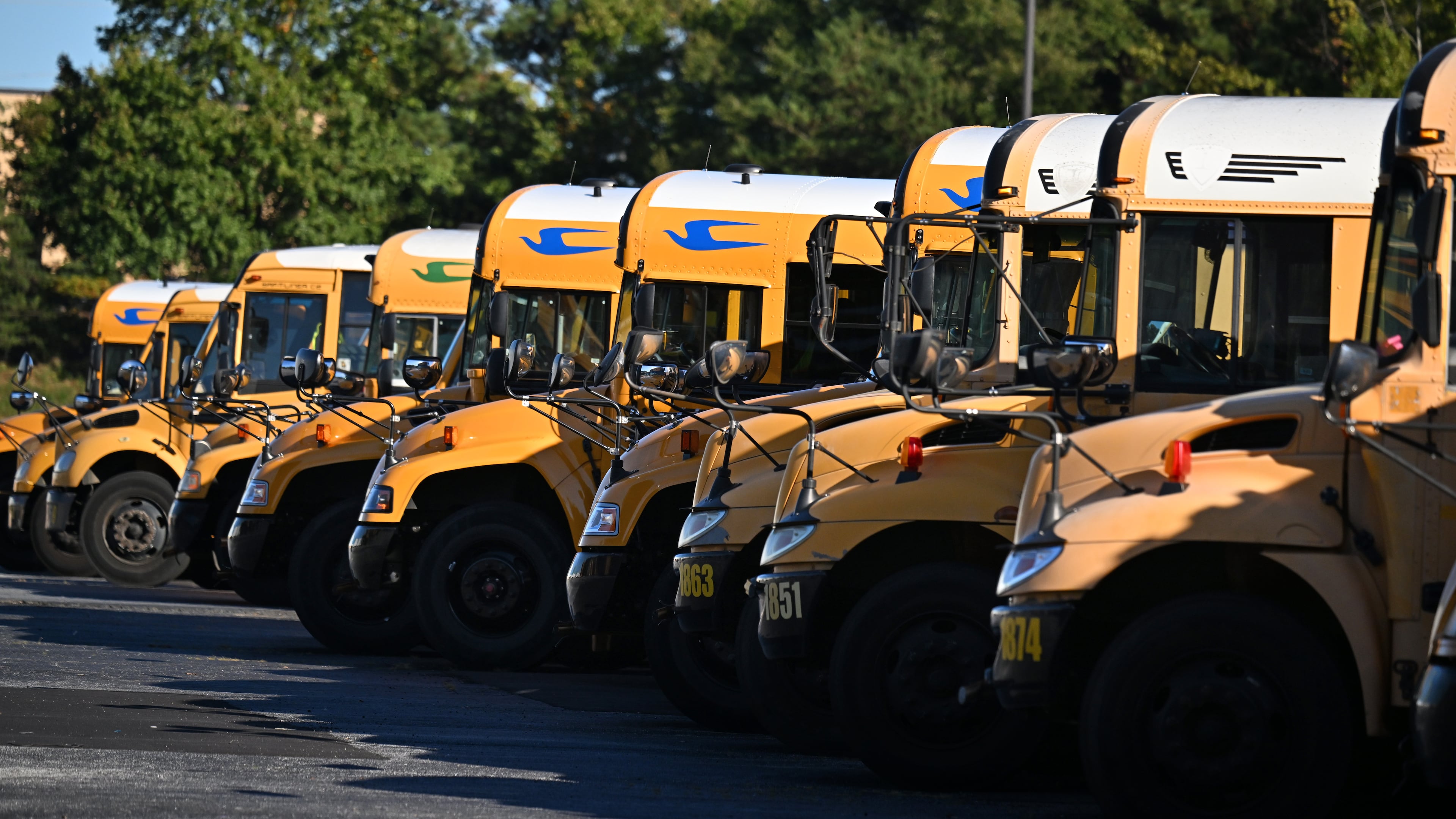 DeKalb County school buses are seen at DeKalb County School District headquarters, Wednesday, October 15, 2025, in Stone Mountain. The school district, and others across metro Atlanta, are canceling weekend activities ahead of this weekend's expected storm. (Hyosub Shin/AJC)