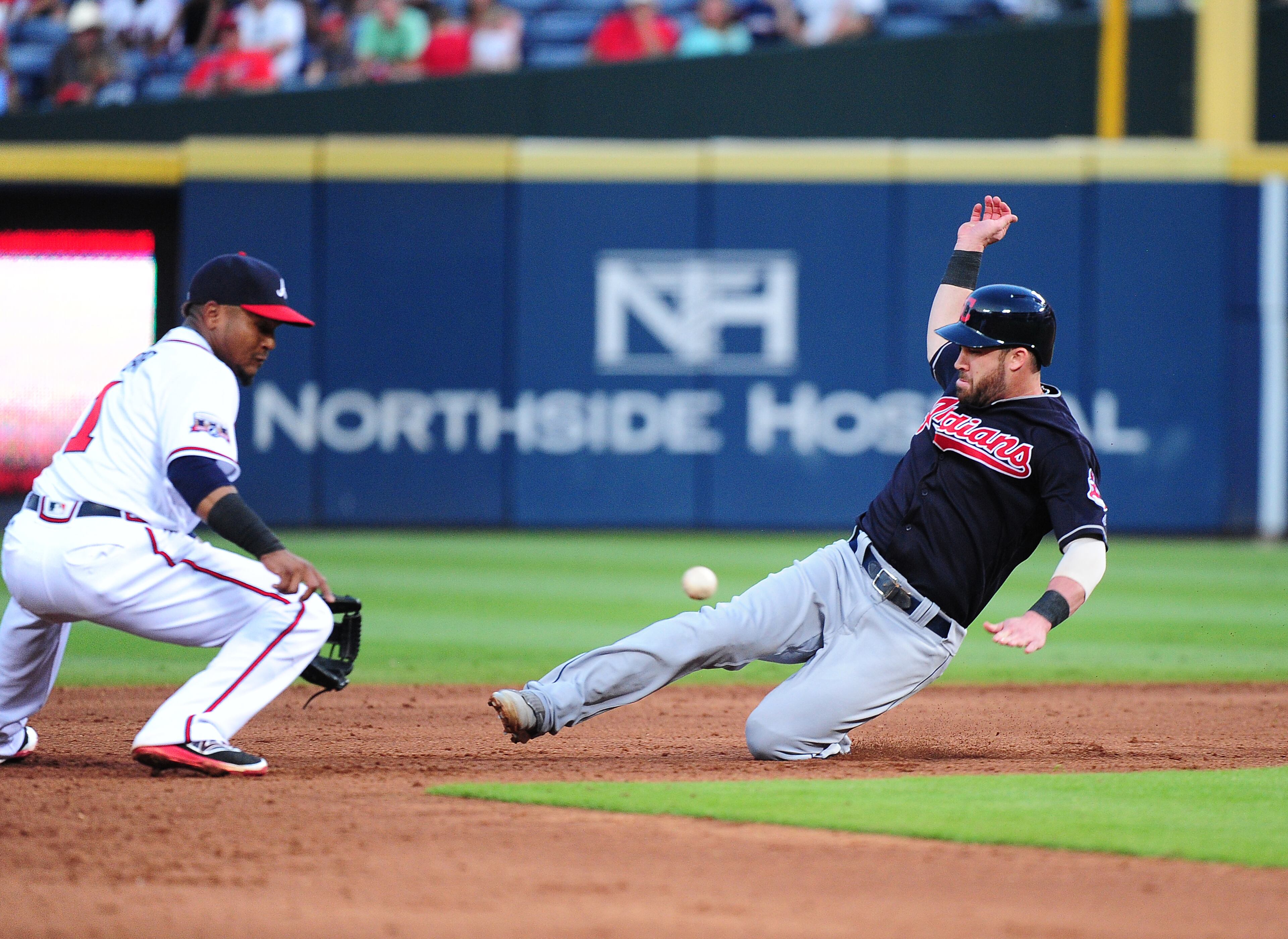 ATLANTA, GA - JUNE 29: Jason Kipnis #22 of the Cleveland Indians steals second base against Erick Aybar #1 of the Atlanta Braves during the fifth inning at Turner Field on June 29, 2016 in Atlanta, Georgia. (Photo by Scott Cunningham/Getty Images)