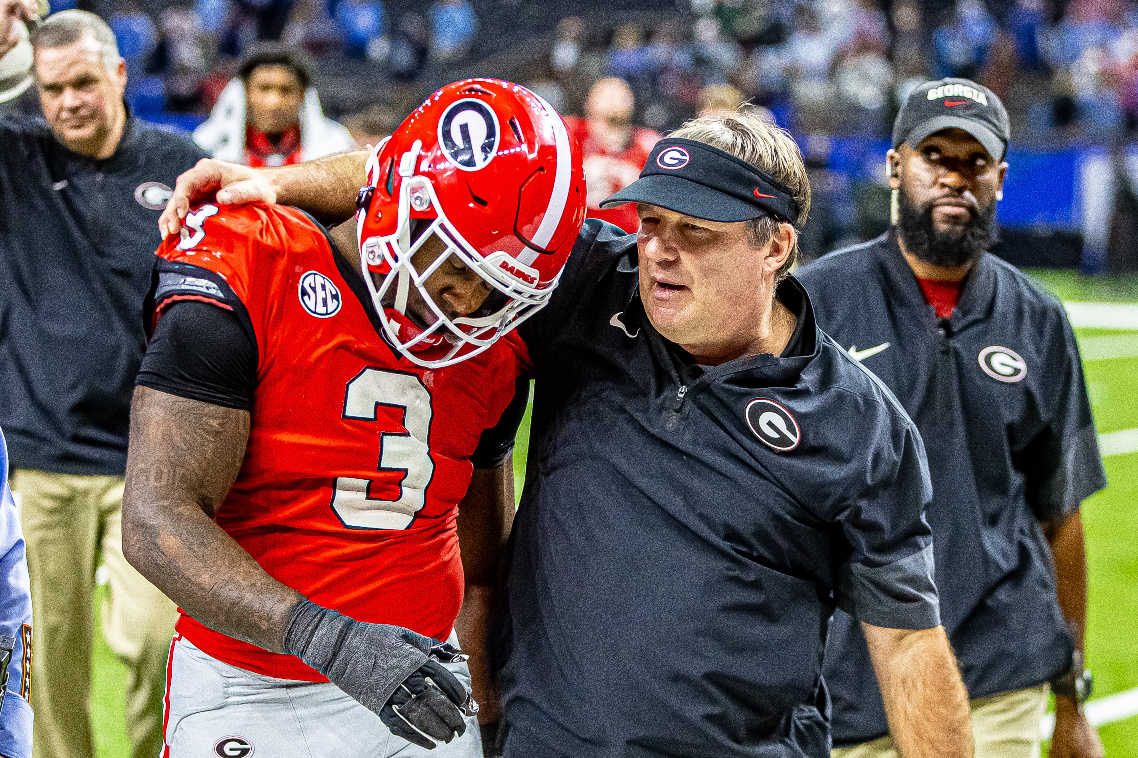 Georgia coach Kirby Smart consoles junior linebacker CJ Allen after the Bulldogs fell 39-34 to Ole Miss in a college football quarterfinal playoff game on January 1, 2026, at the Caesar's Superdome in New Orleans, Louisiana. (Jeff Sentell/DawgNation)