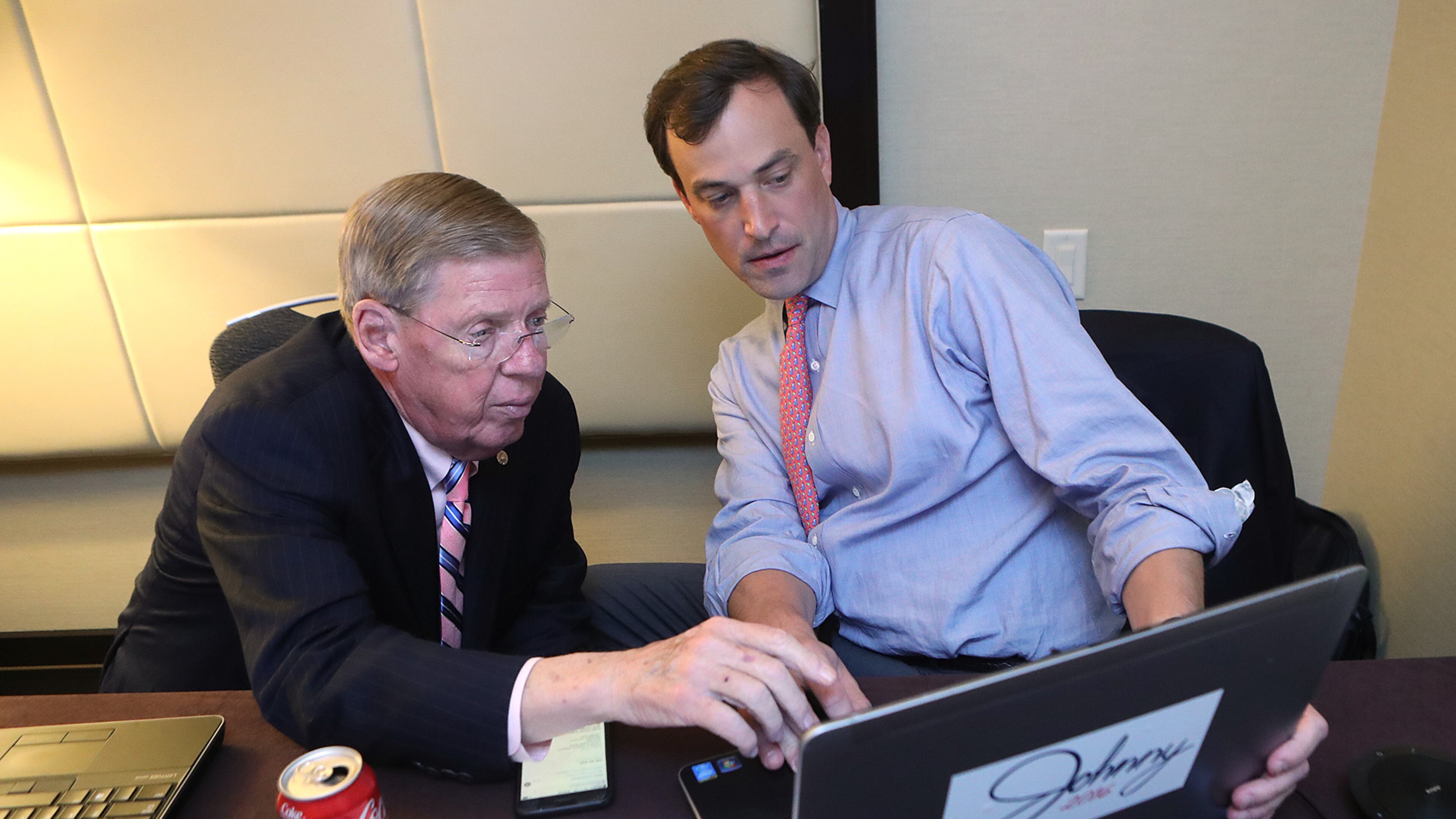 U.S. Sen. Johnny Isakson and campaign manager Trey Kilpatrick watch returns from his war room upstairs from the Republican Watch party at the Grand Hyatt, Buckhead, on Tuesday, Nov. 7, 2016, in Atlanta. Curtis Compton /ccompton@ajc.com
