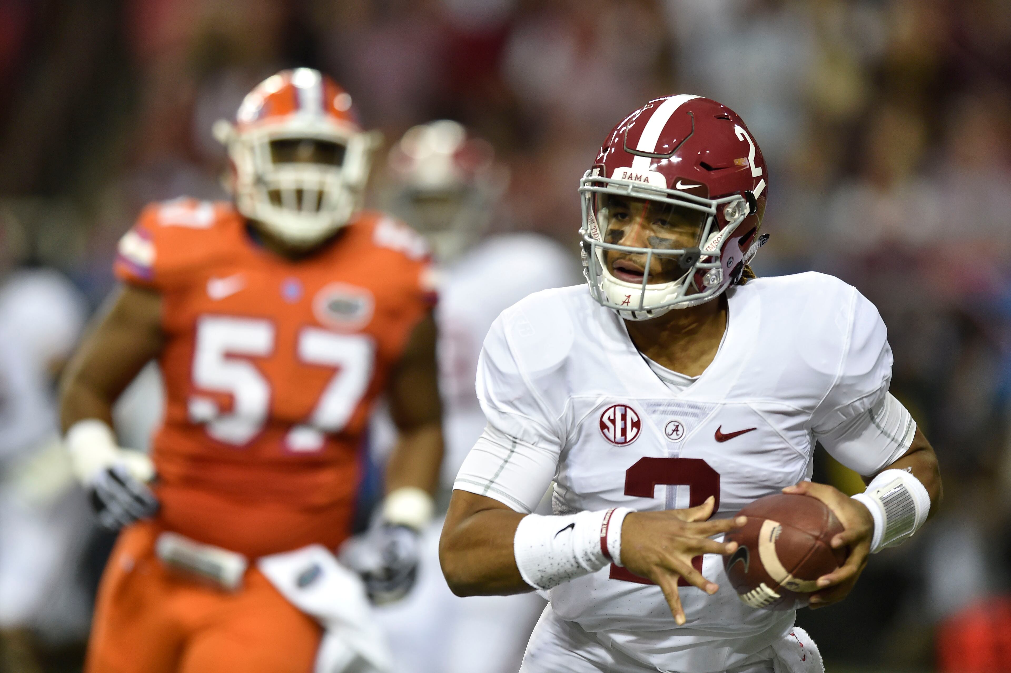 December 3, 2016, Atlanta - Alabama quarterback Jalen Hurts (2) runs with the ball during the SEC Championship Game between the Alabama Crimson Tide and the Florida Gators in Atlanta, Georgia, on Saturday, December 3, 2016. (DAVID BARNES / DAVID.BARNES@AJC.COM)