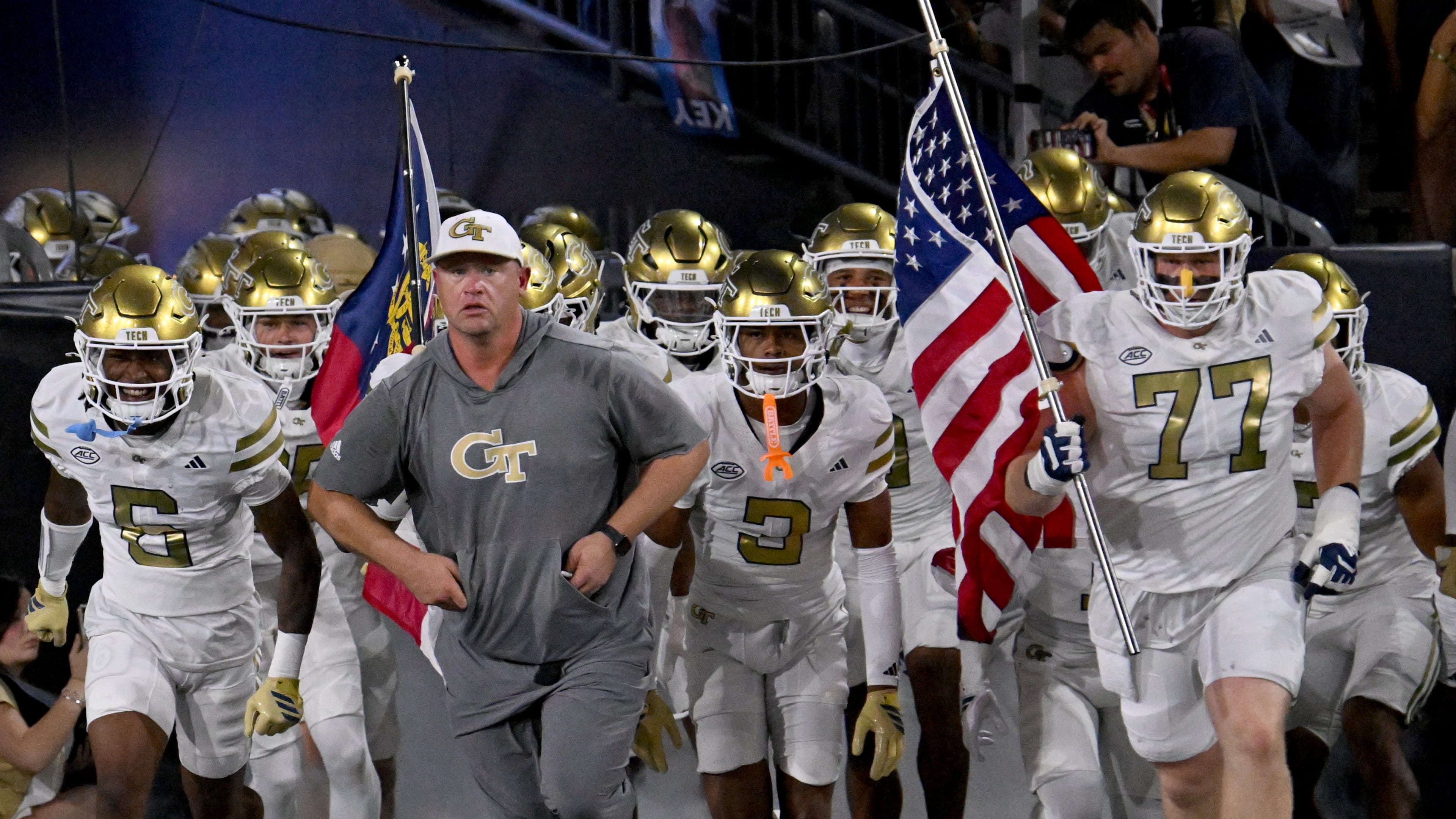 Georgia Tech head coach Brent Key and players run onto the field before the final regular-season home game against Pittsburgh at Bobby Dodd Stadium in Atlanta. (Hyosub Shin/AJC 2025)